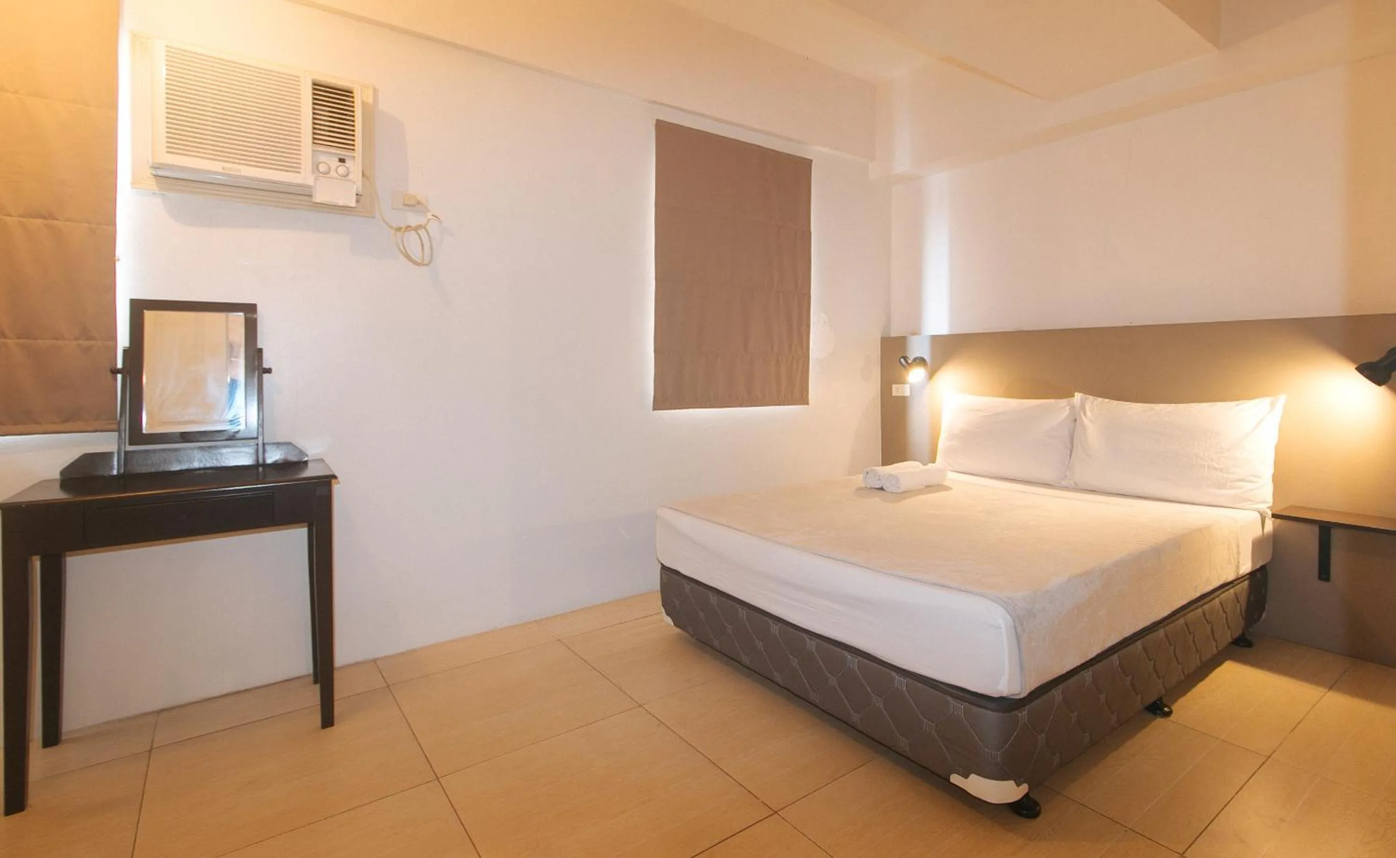 Bed in 59 Xavierville by RedDoorz