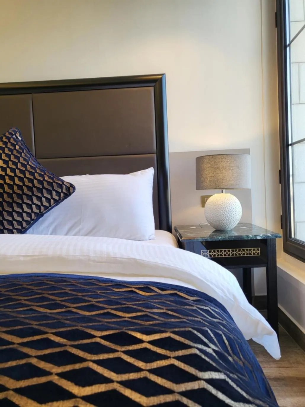 Bed in Ambassador, a Boutique Hotel