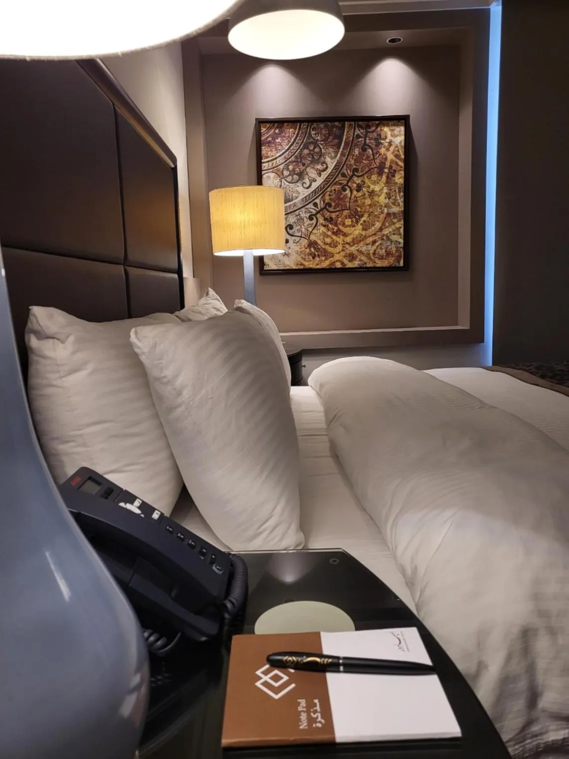 Bed in Ambassador, a Boutique Hotel