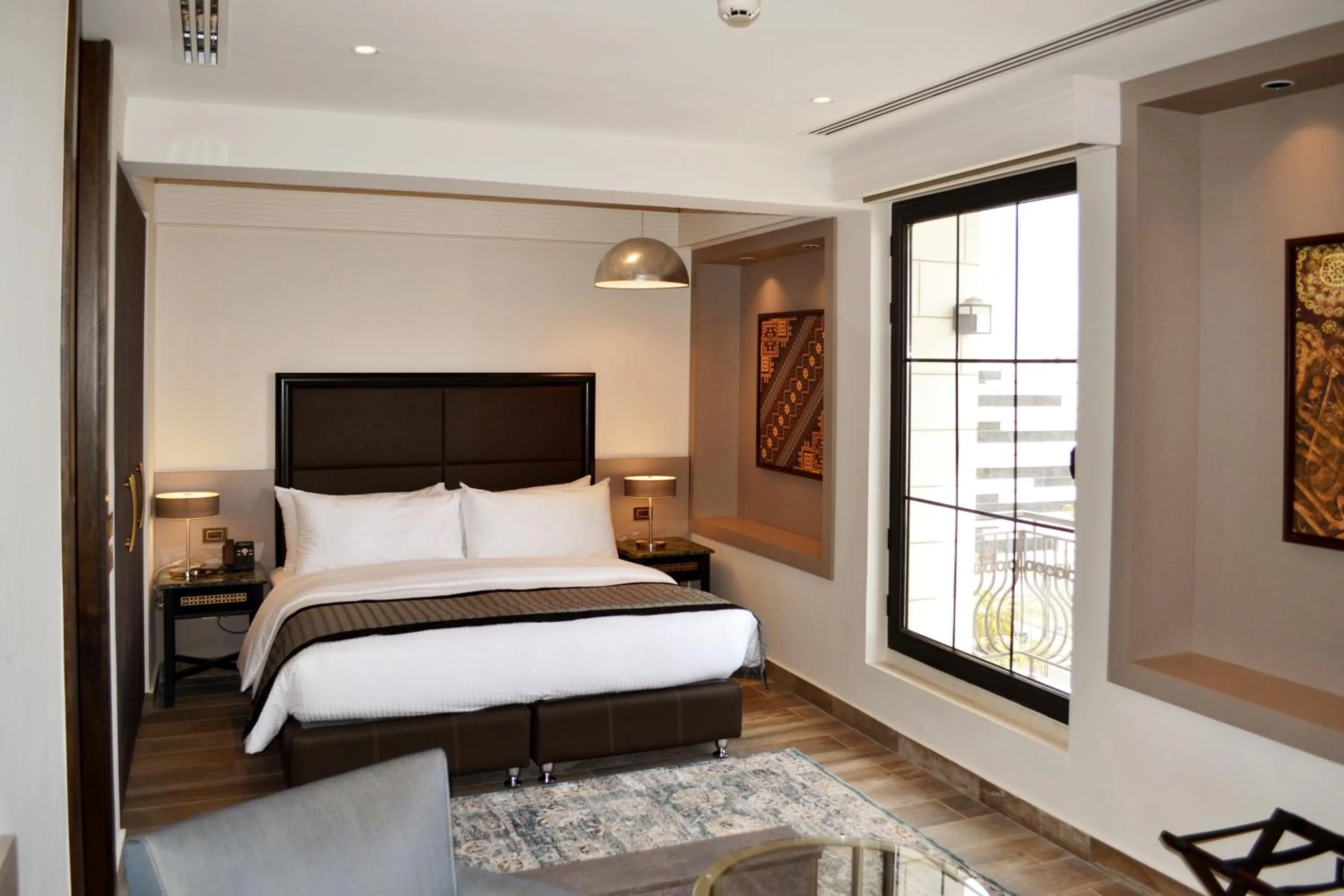 Bed in Ambassador, a Boutique Hotel