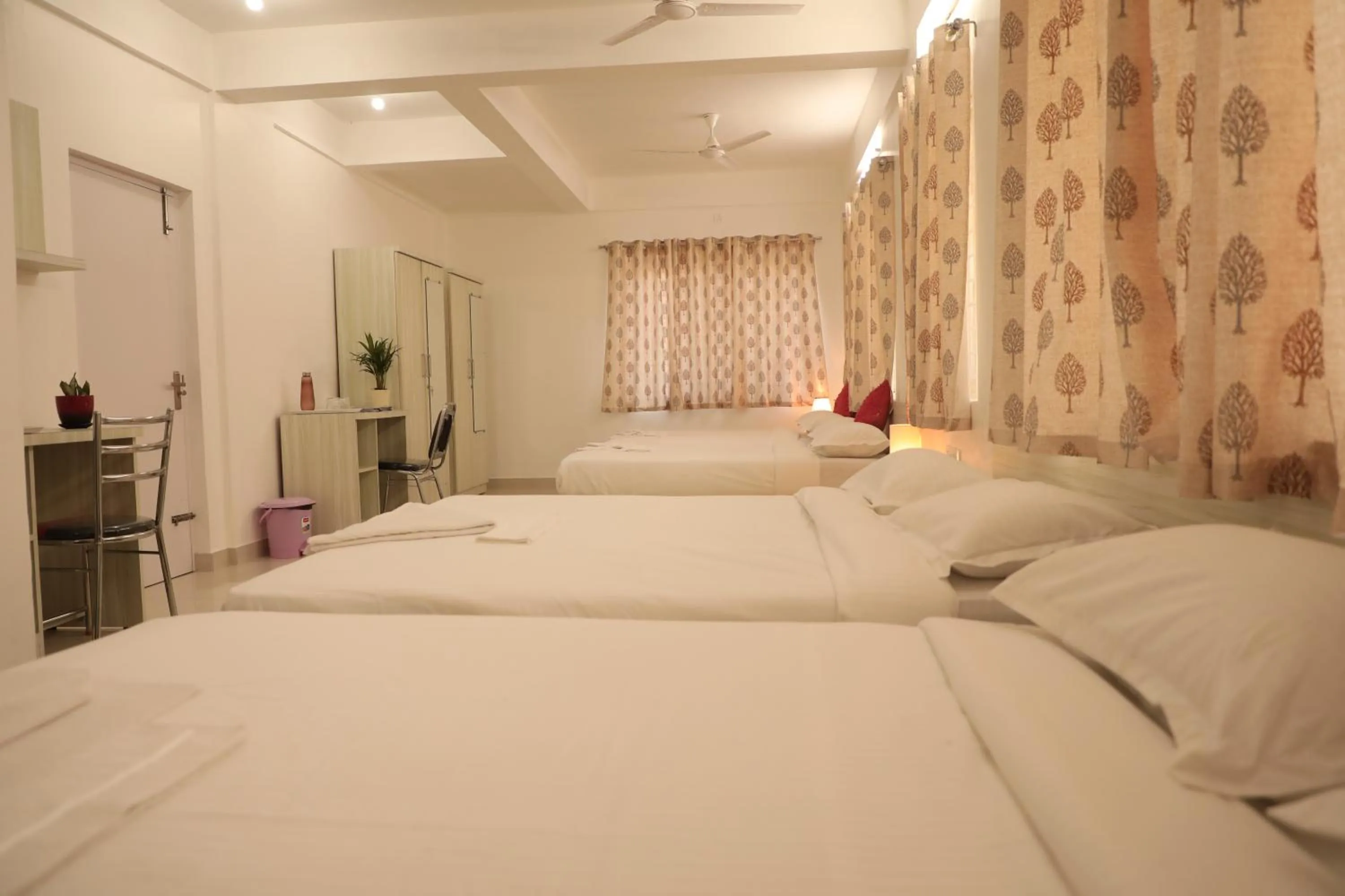 Bed in Sai Inn Mysore