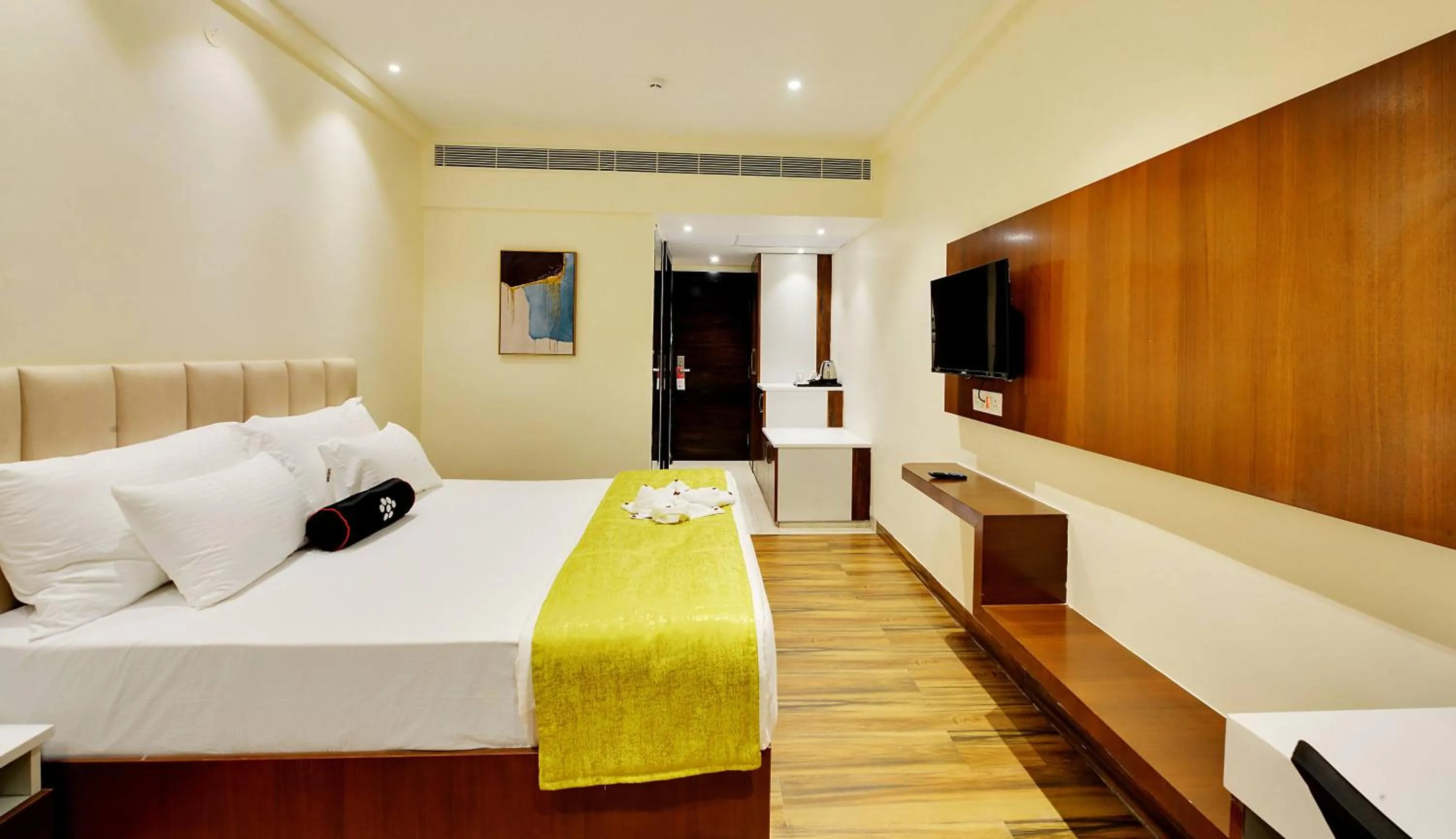 Bed in Mastiff Select Gulbarga Hotel