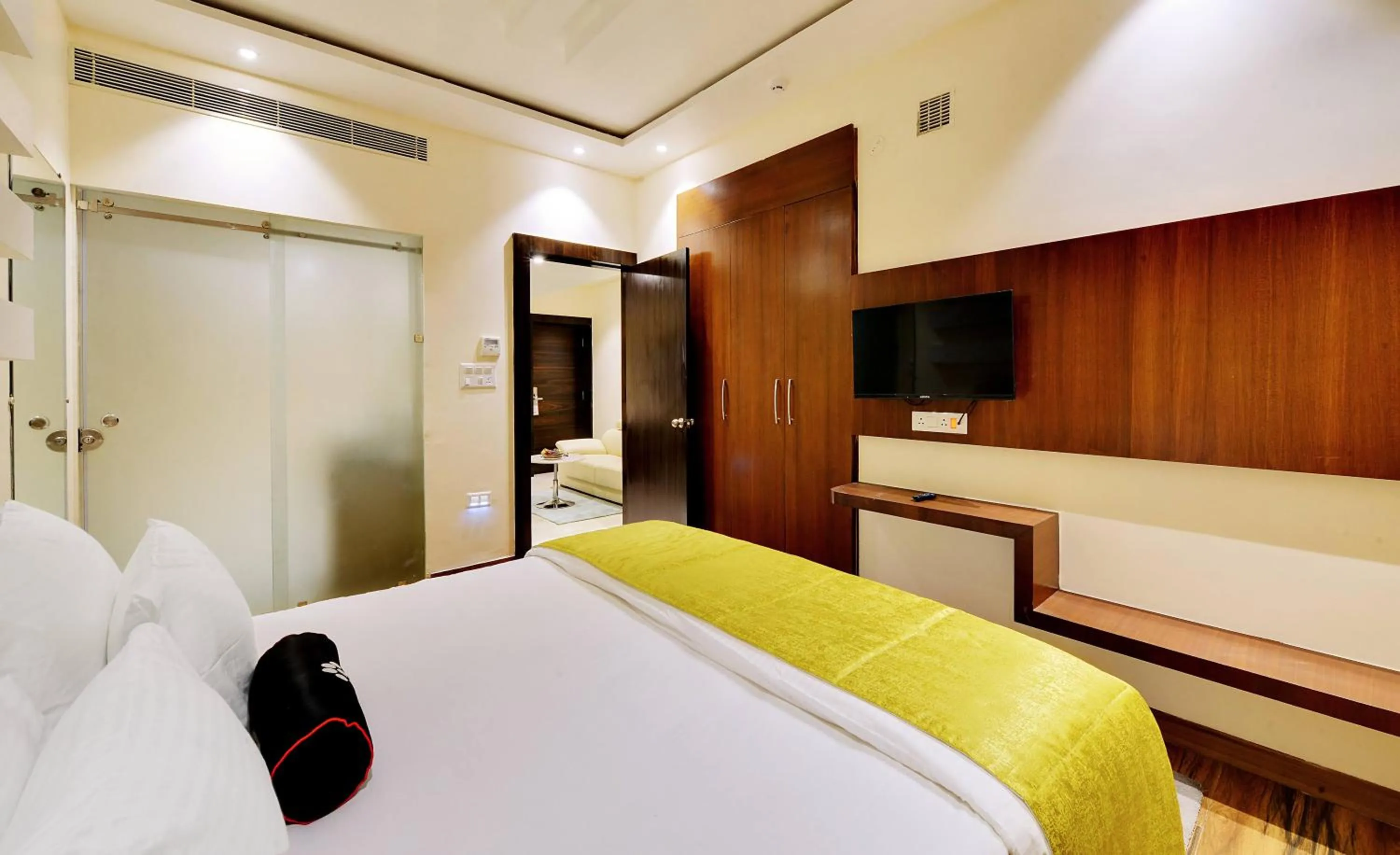 Bed in Mastiff Select Gulbarga Hotel