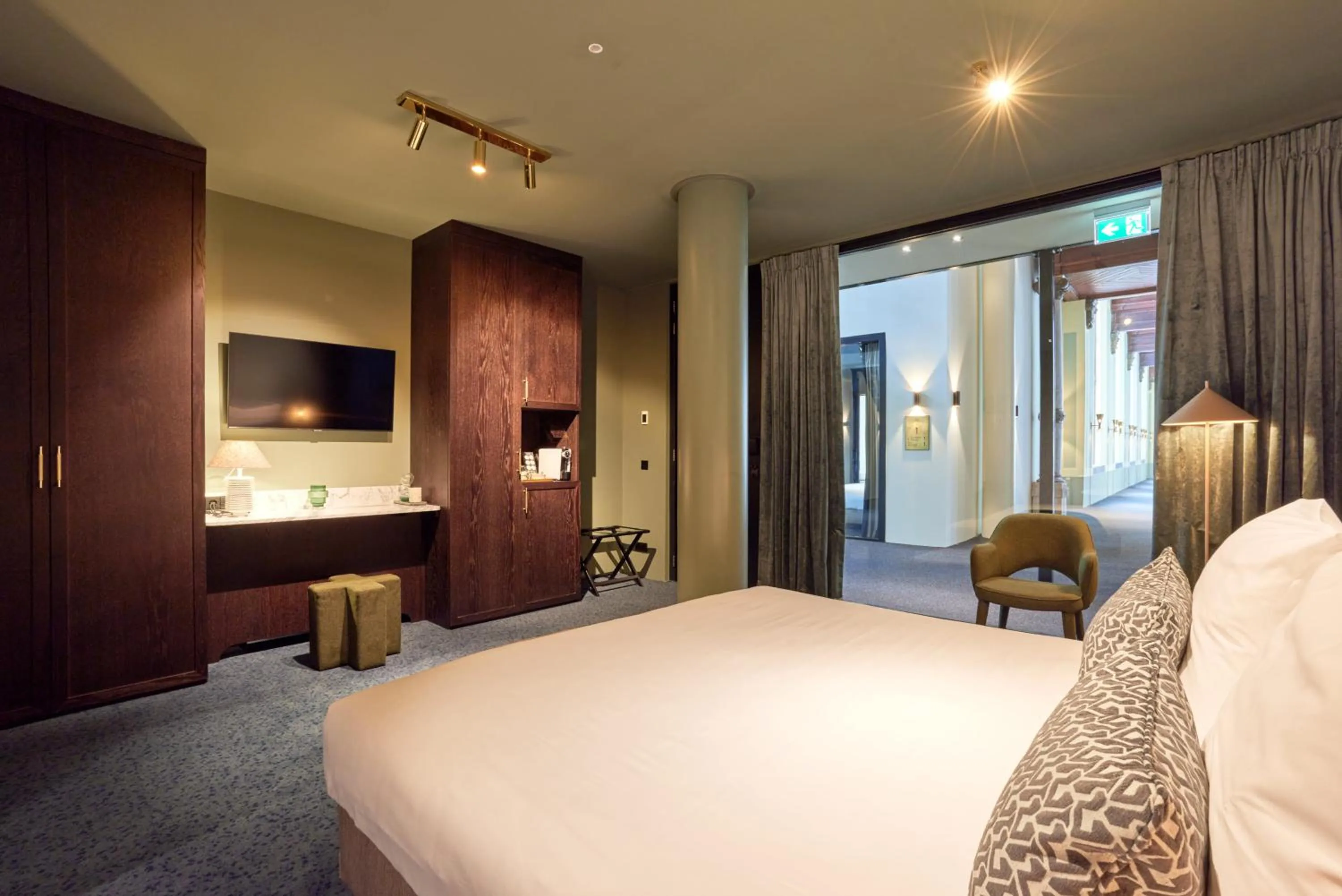 Seating area, Bed in Heavens Hotel