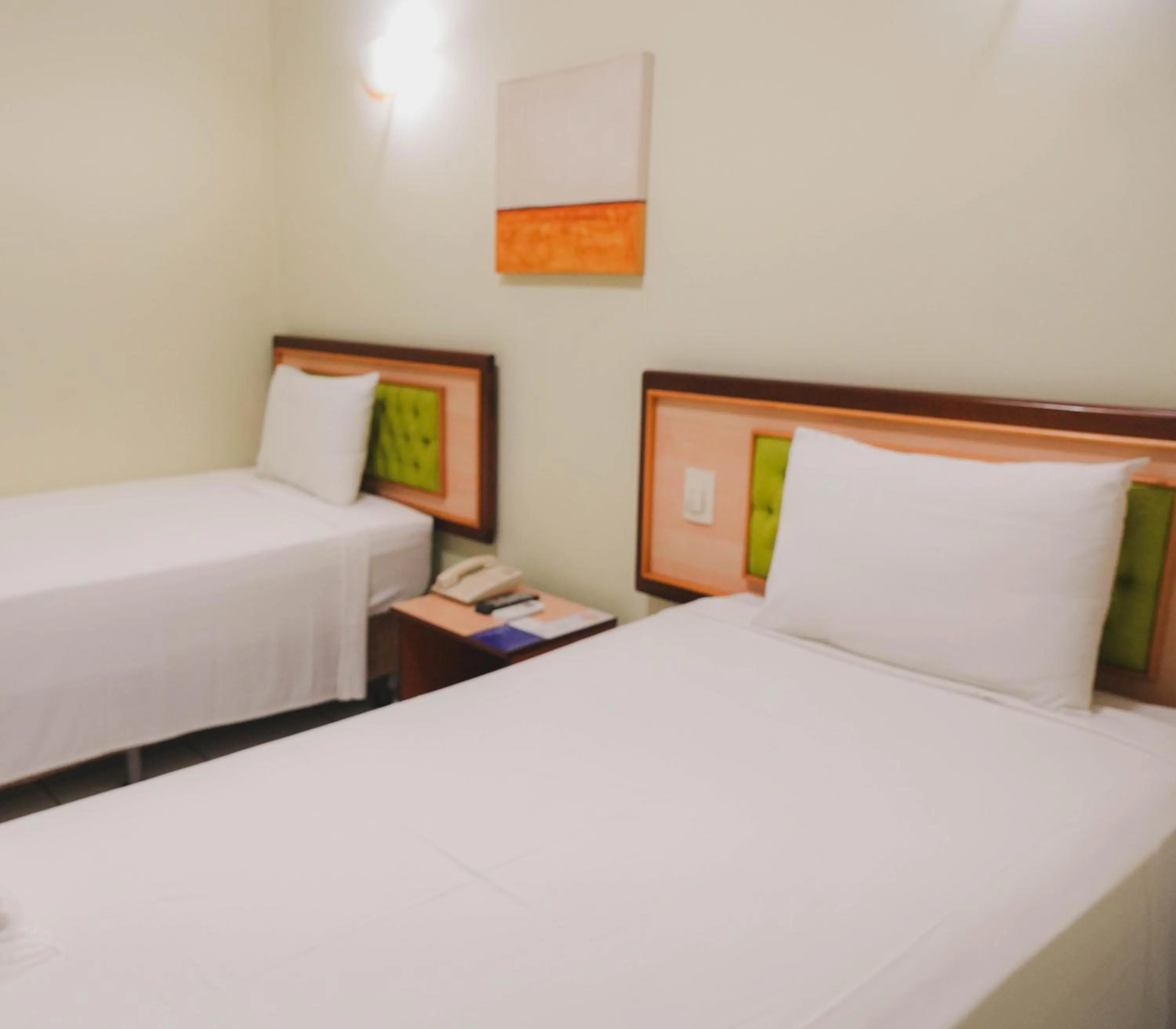 Bed in Larison Ji-Paraná by - Easy Hotéis