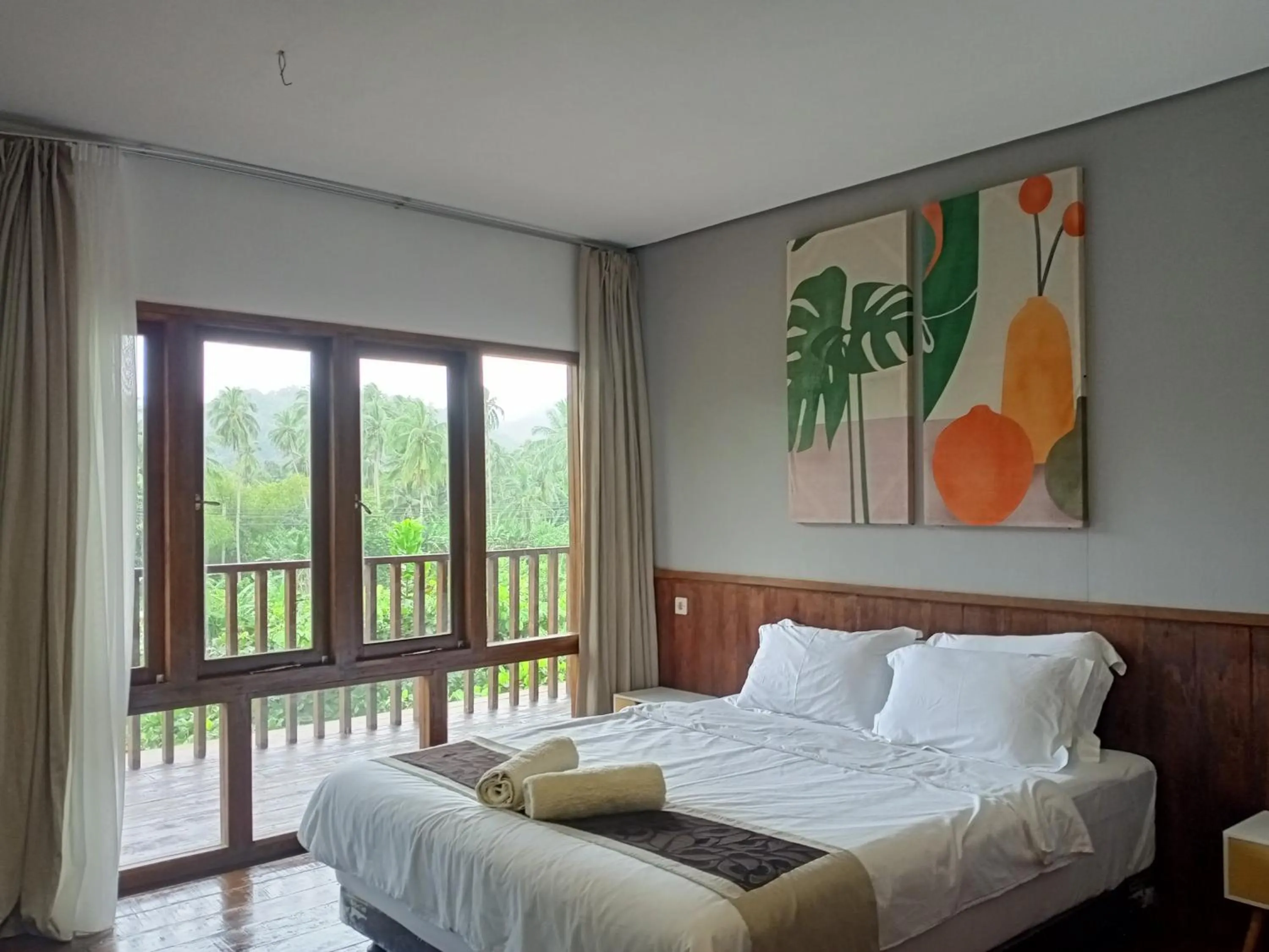 Balcony/Terrace, Bed in Natuna Dive Resort