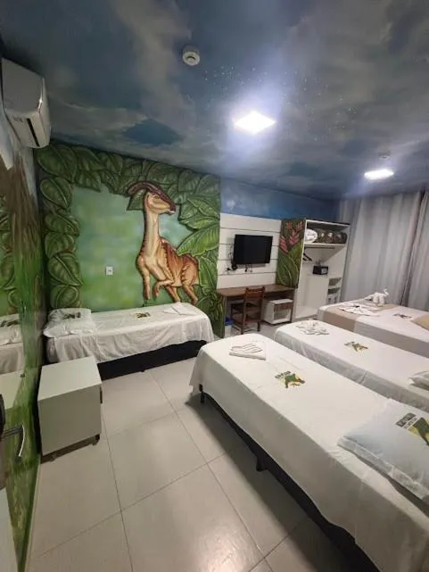 Bed in Hotel Recanto dos Dinossauros