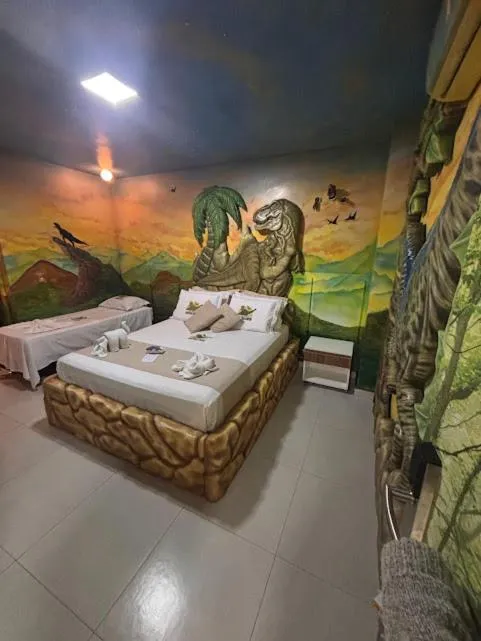 Bed in Hotel Recanto dos Dinossauros