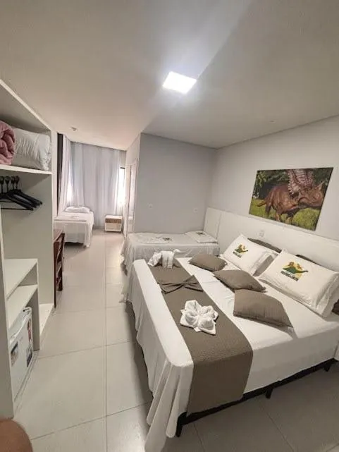 Bed in Hotel Recanto dos Dinossauros