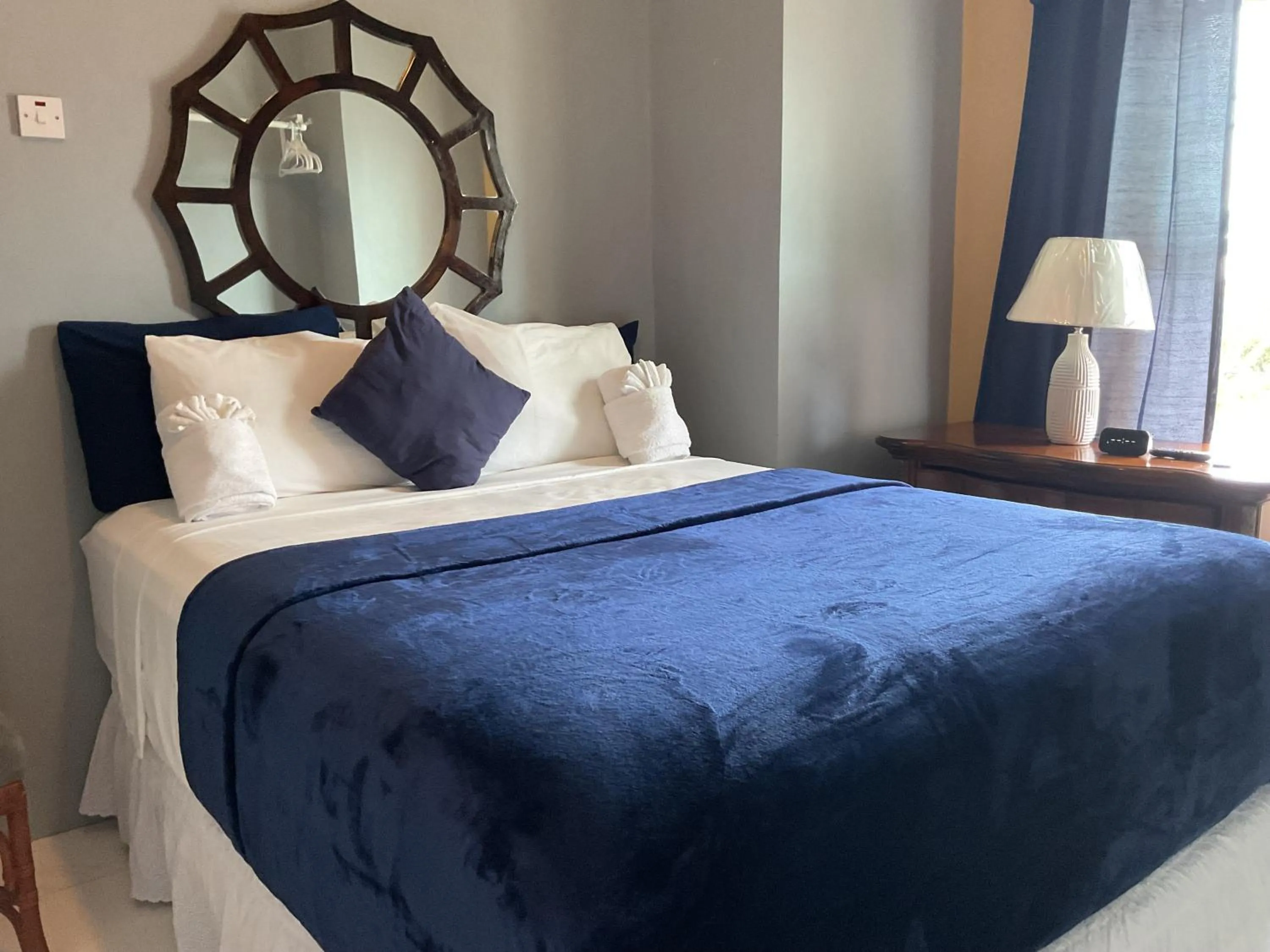 Bed in A taste of Jamaica Lavern’s Place