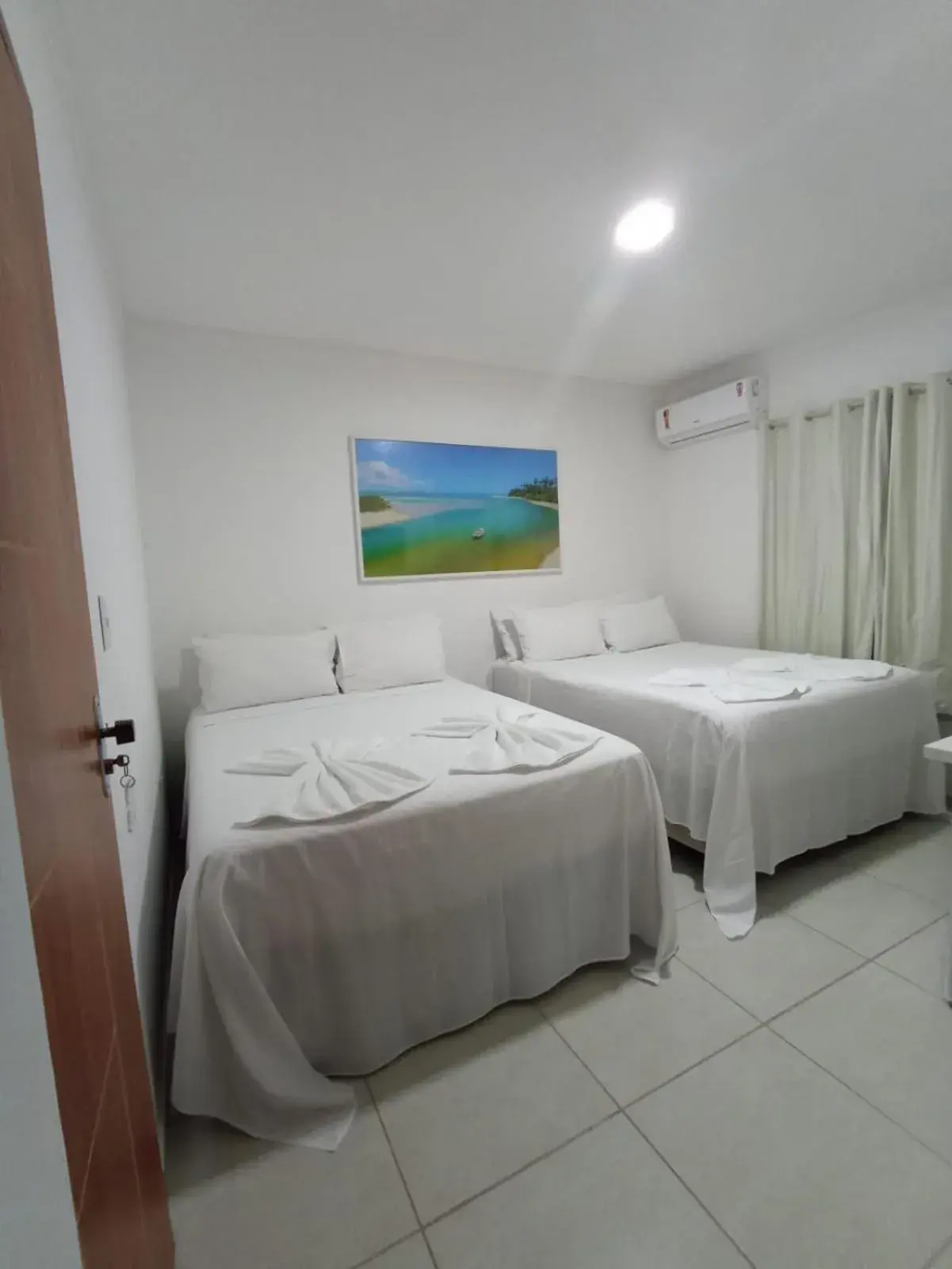 Quadruple Room in Pousada Villa Costeira Quadruple Room in Pousada Villa Costeira