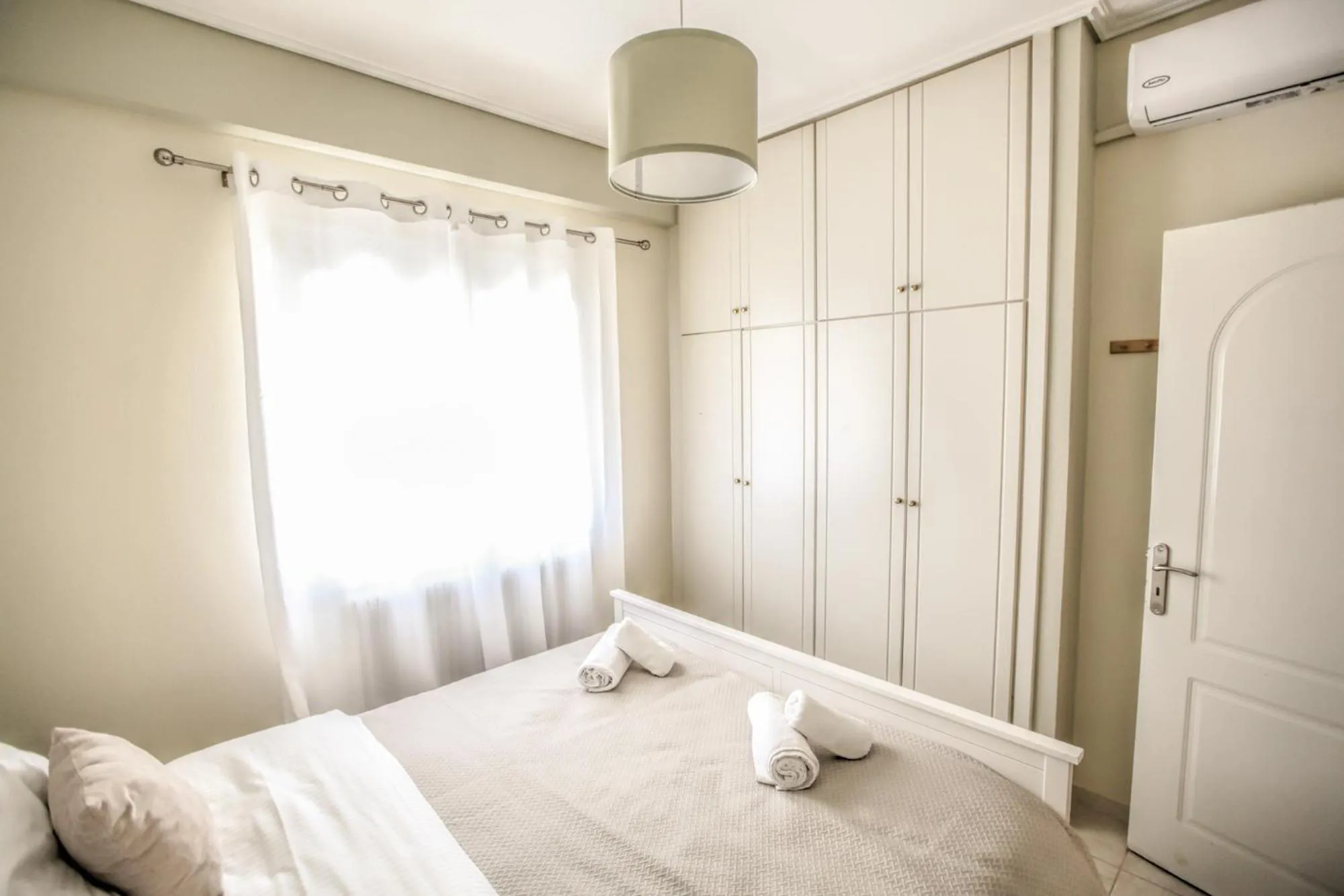 Bed in Grand Meteora Central Luxury Apartment