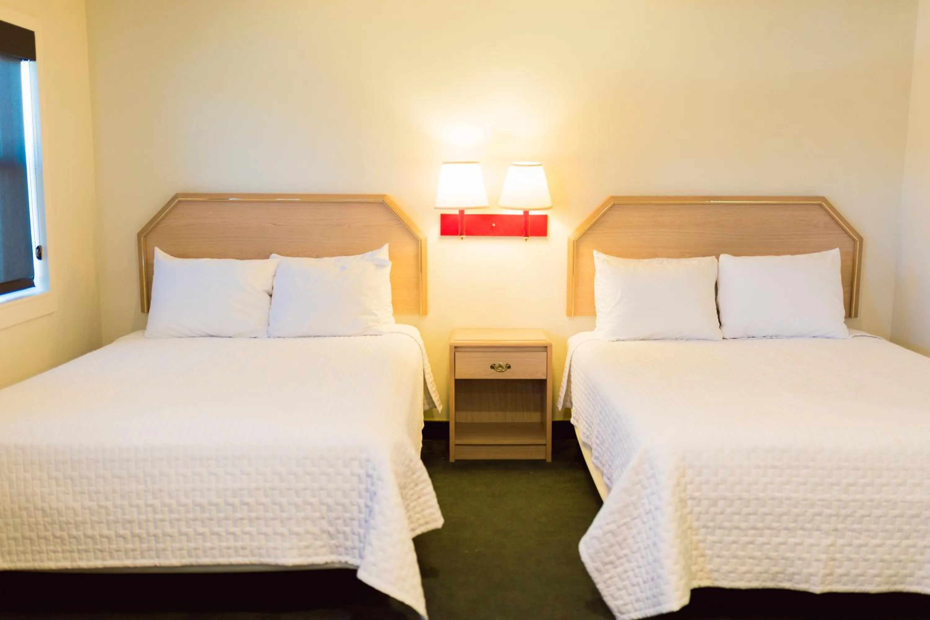 Bed in Two Sunsets Hotel