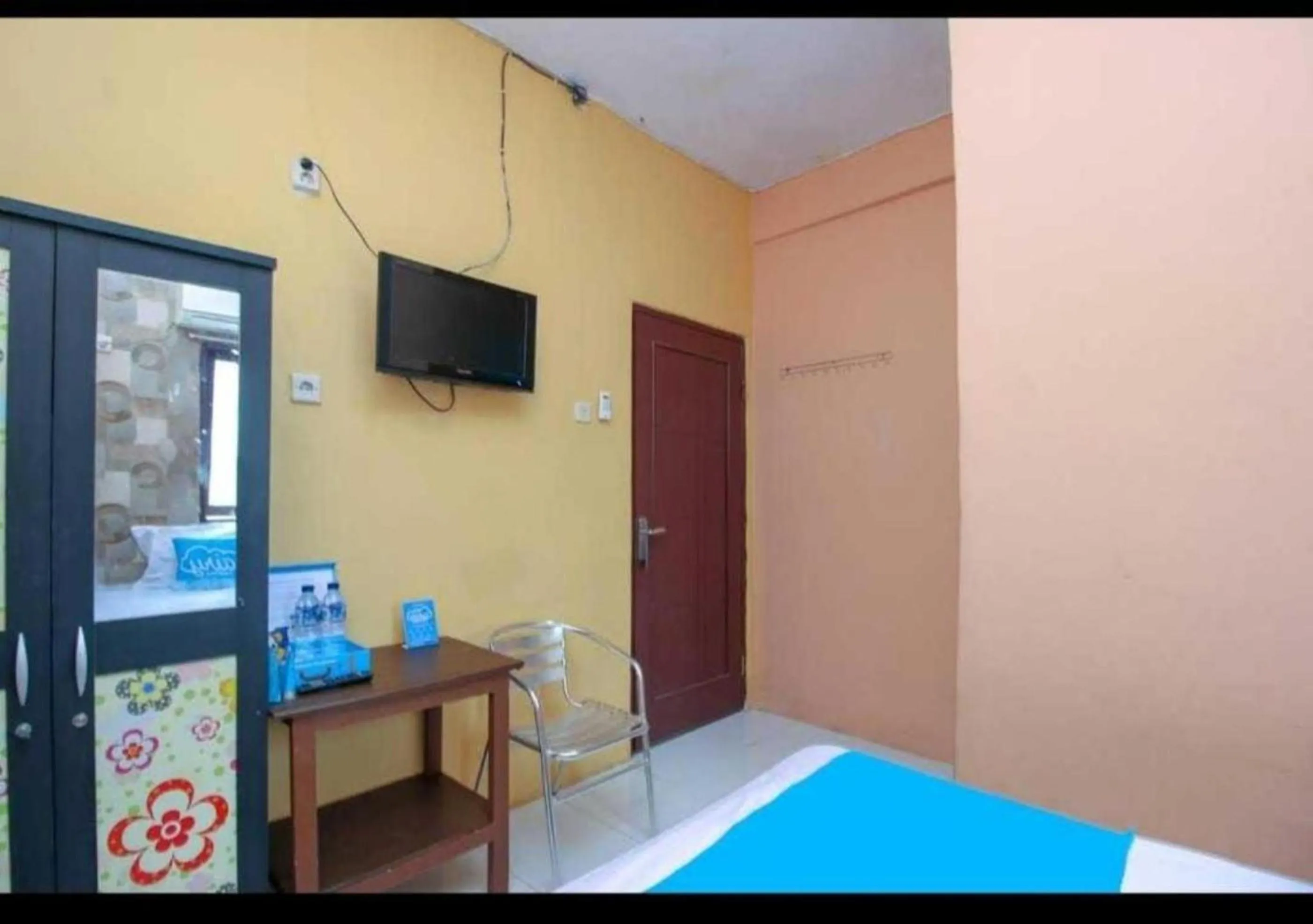 Communal lounge/ TV room, Bed in Ambon Residence Syariah