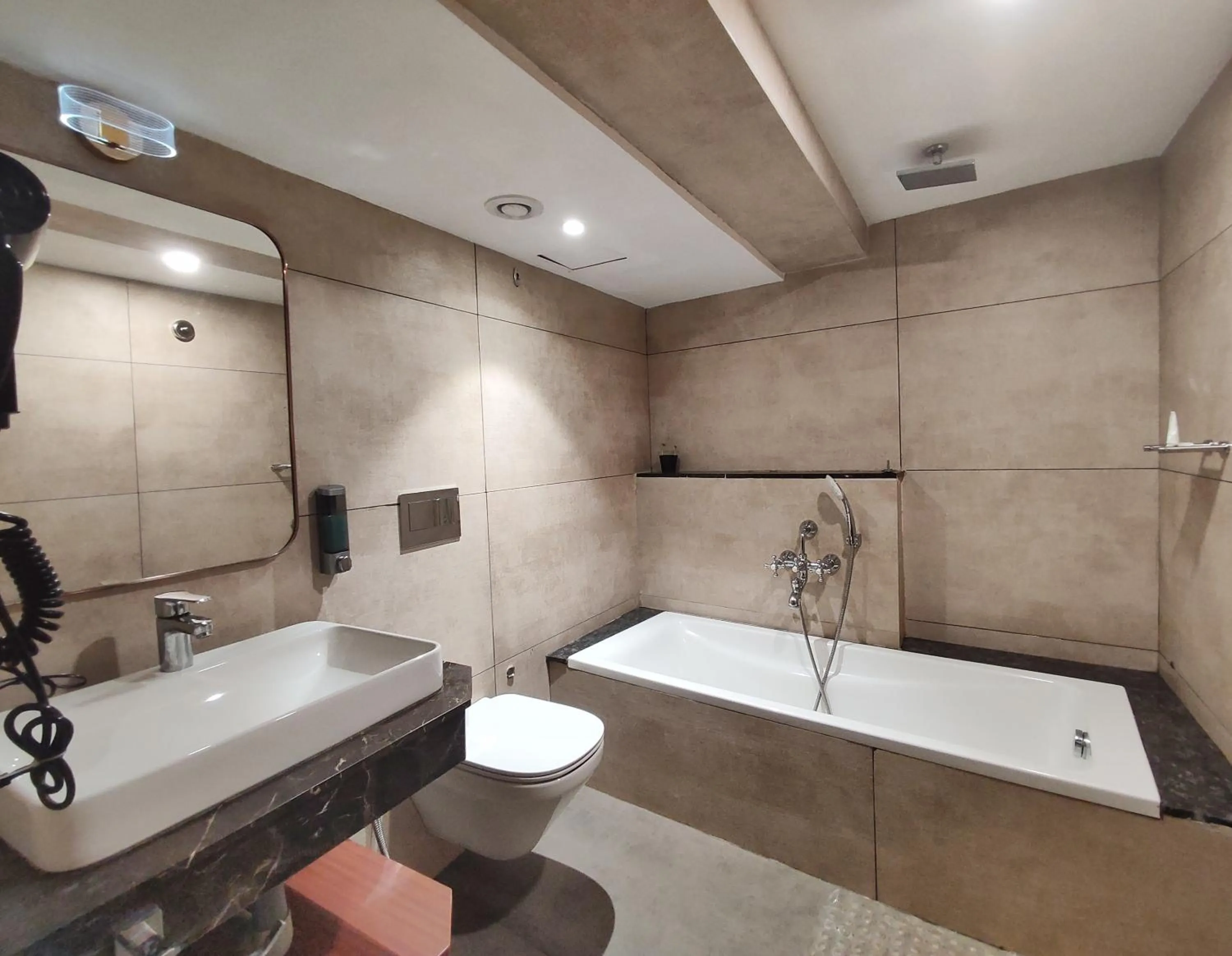 Bathroom in Royal Plaza Suites by RAK Rooms, Mangaluru