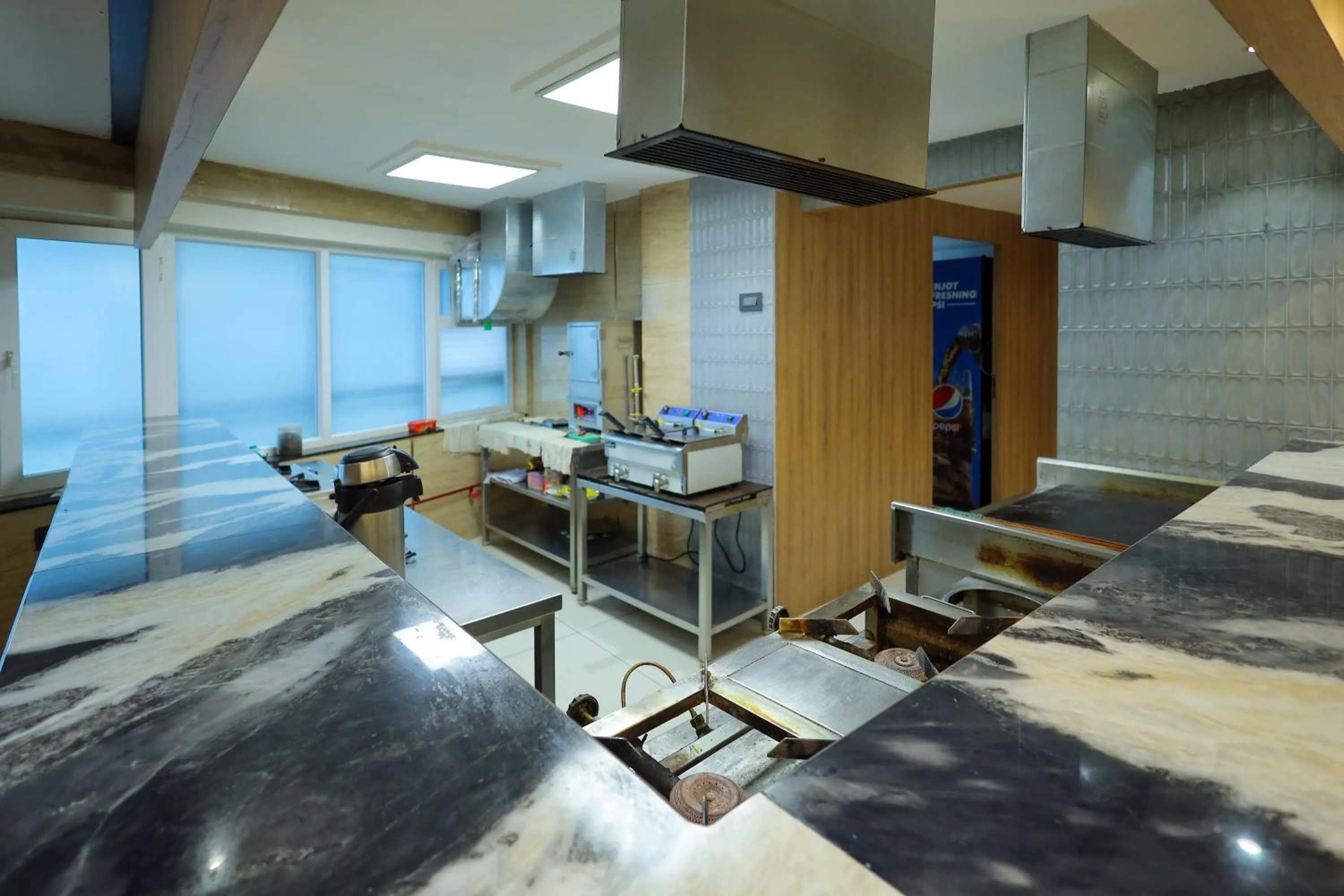 kitchen in Royal Plaza Suites by RAK Rooms, Mangaluru