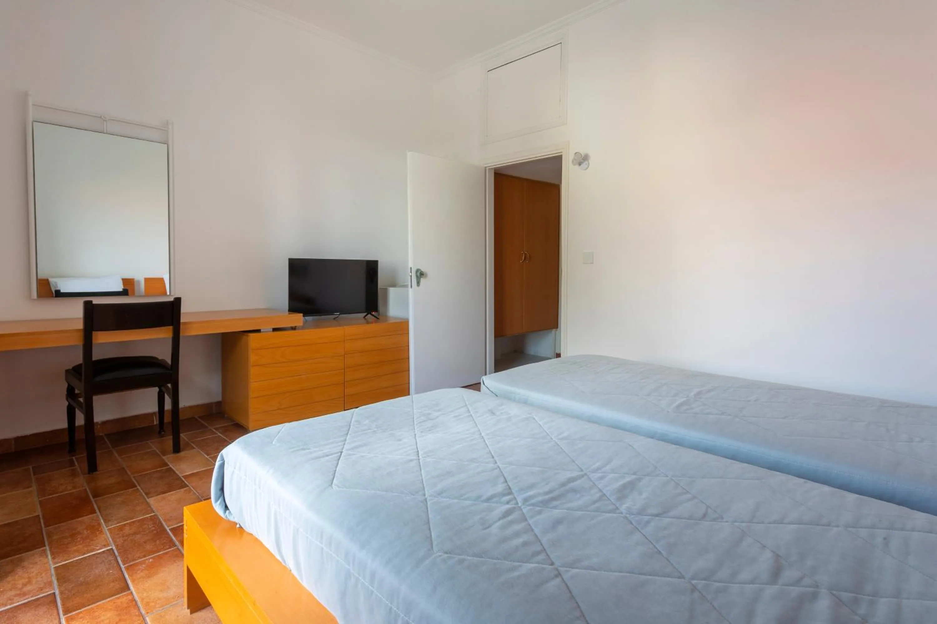 Bed in Hotel Roumani