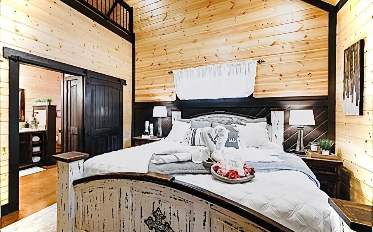 Bedroom, Bed in Knotty and Nice Luxury Cabin