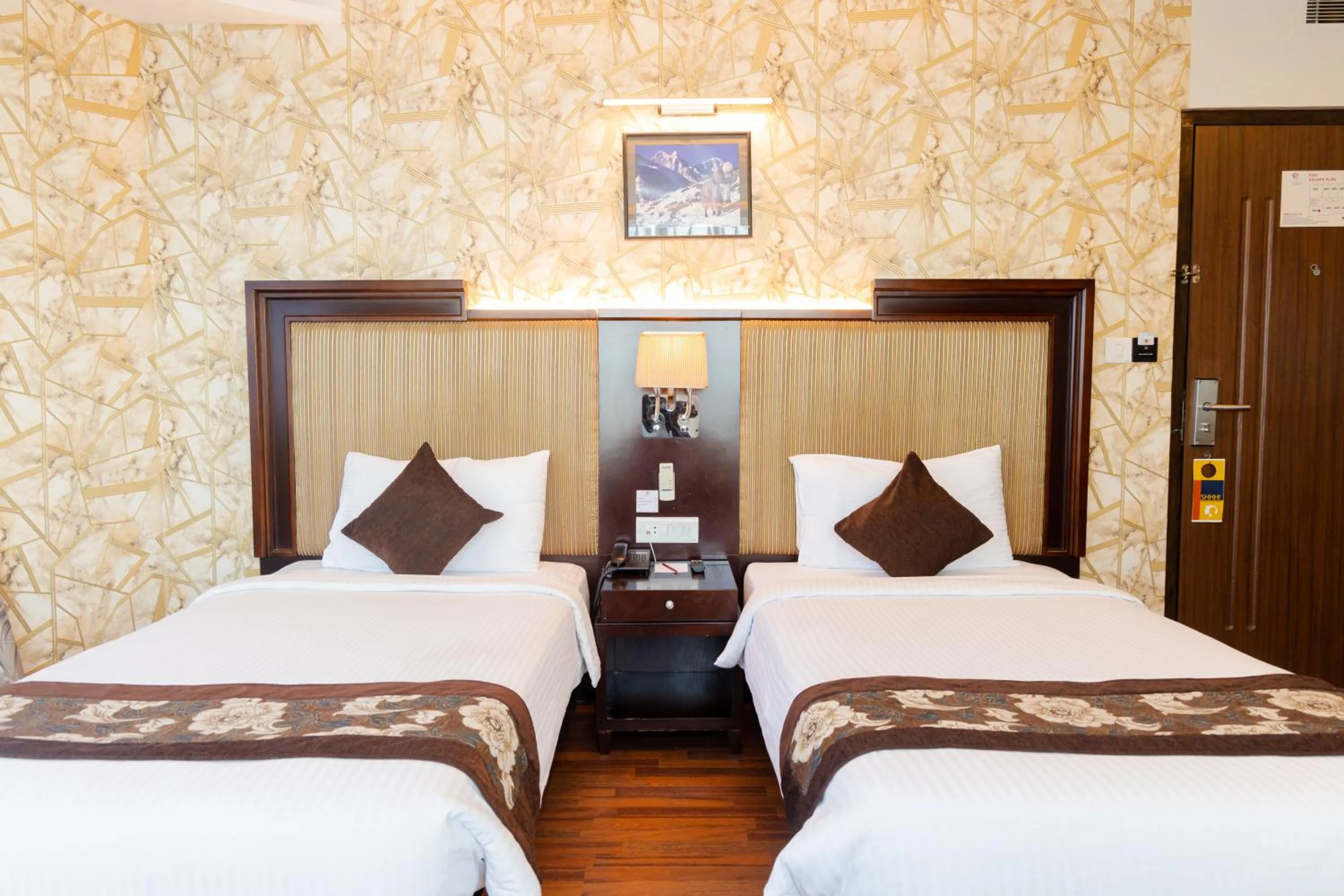 Bed in Hotel Mirage Regency