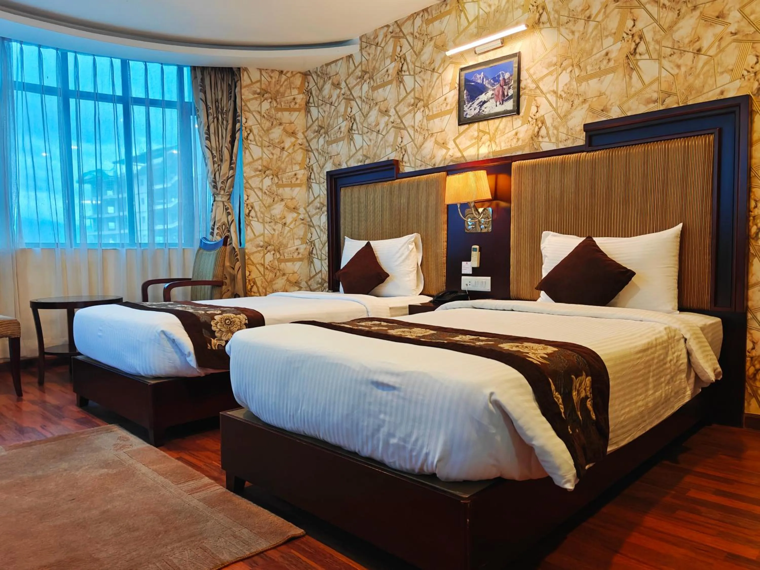 Bed in Hotel Mirage Regency