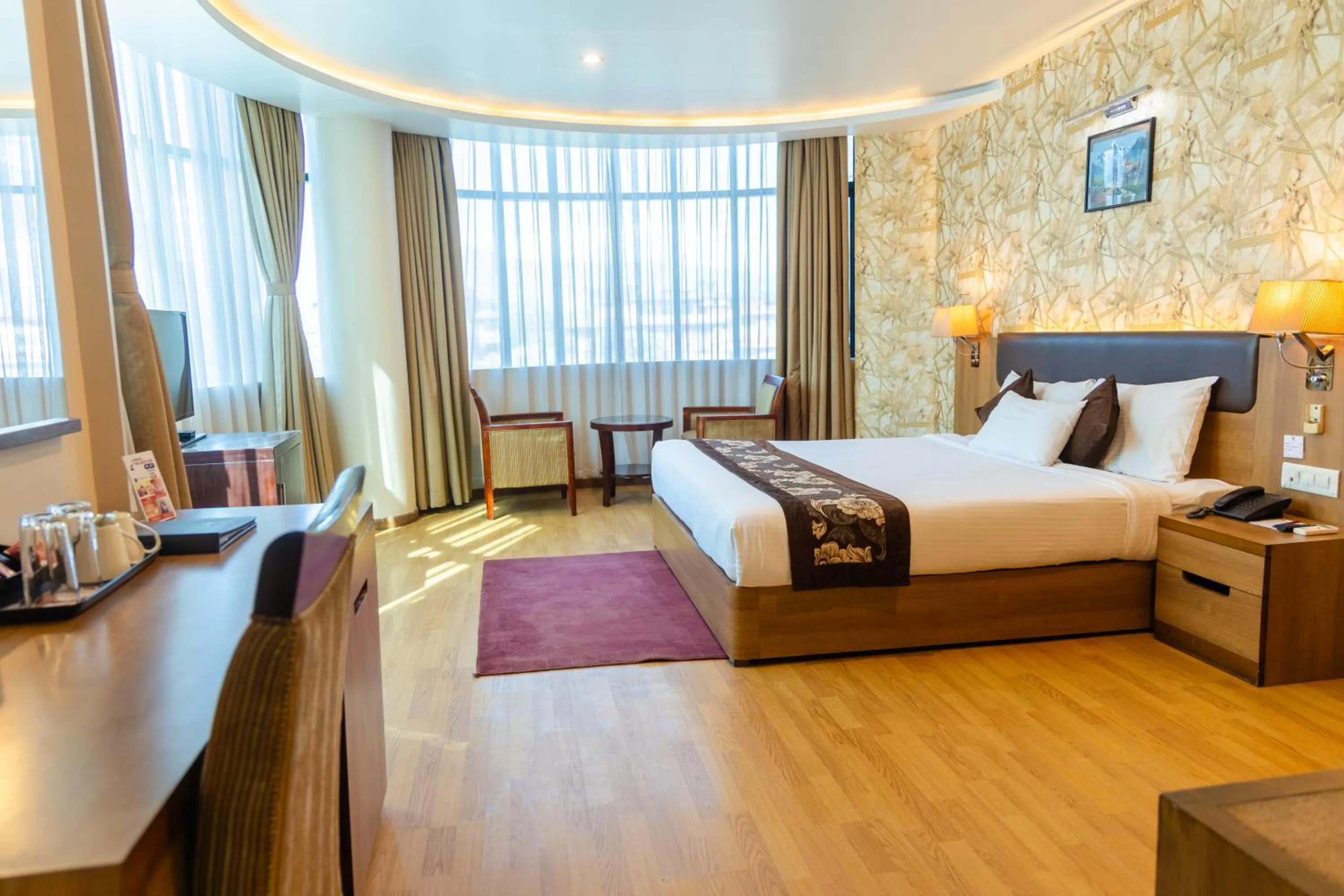 Bed in Hotel Mirage Regency