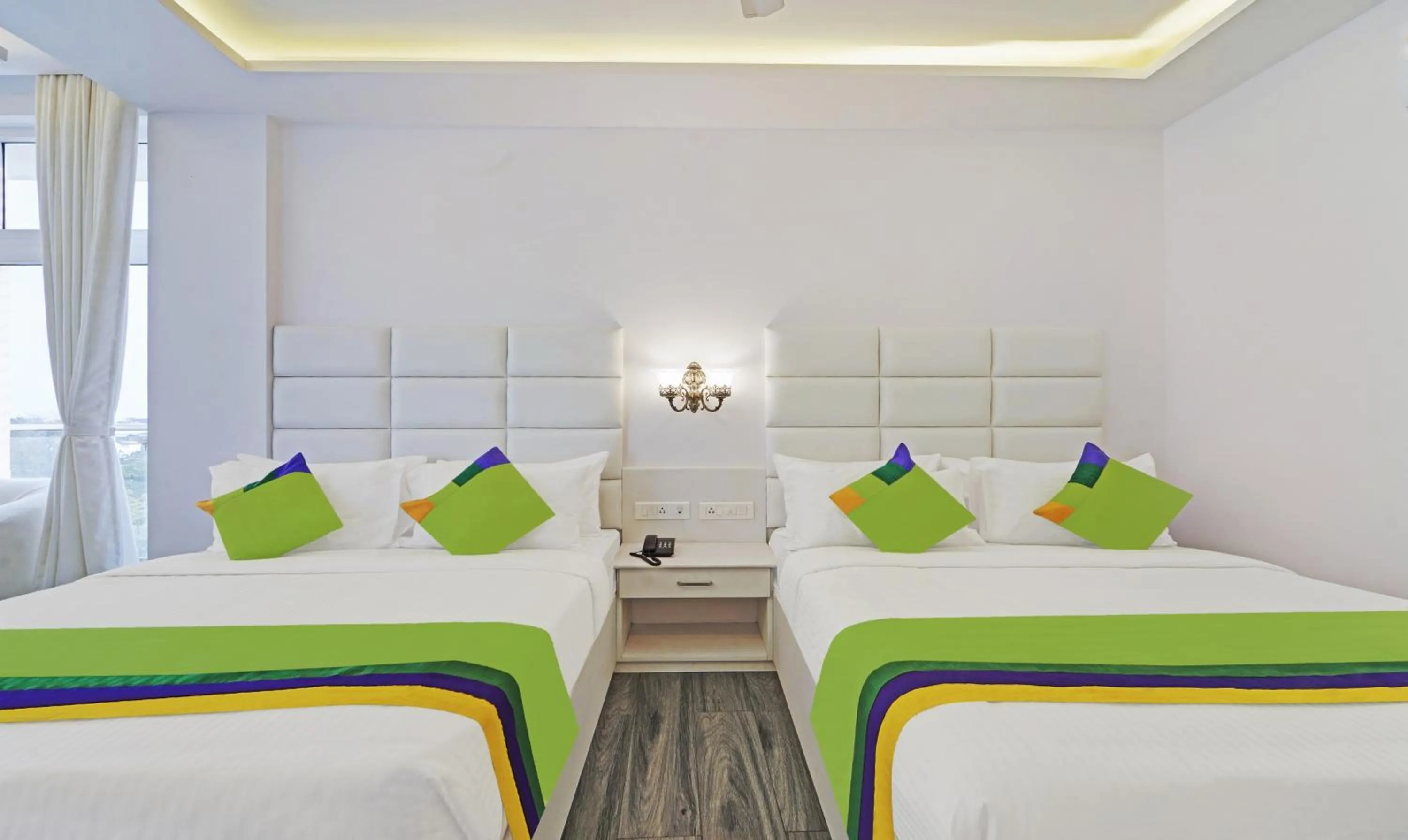 Bed in Treebo Premium Raffis' Andalusia Bay Way