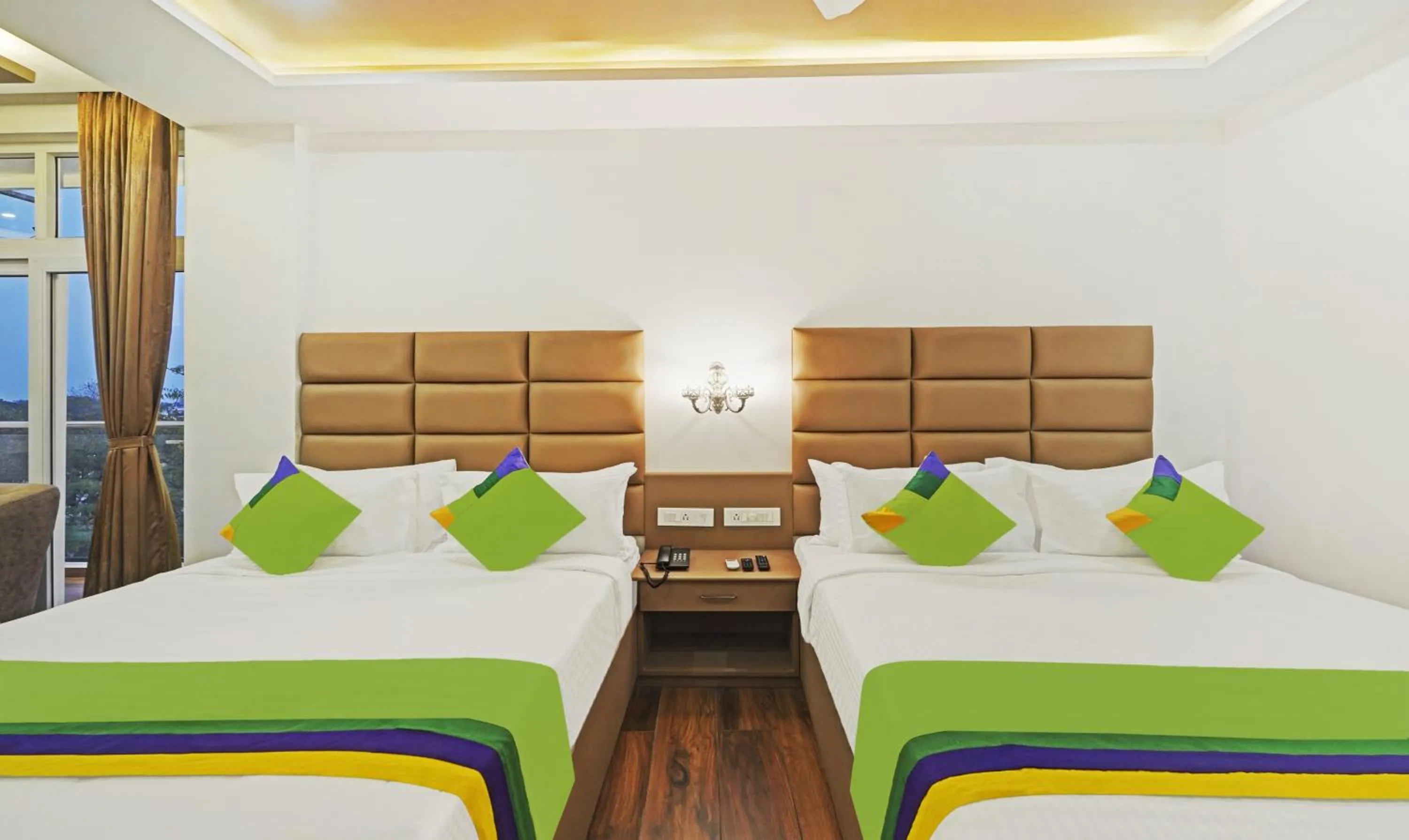 Bed in Treebo Premium Raffis' Andalusia Bay Way