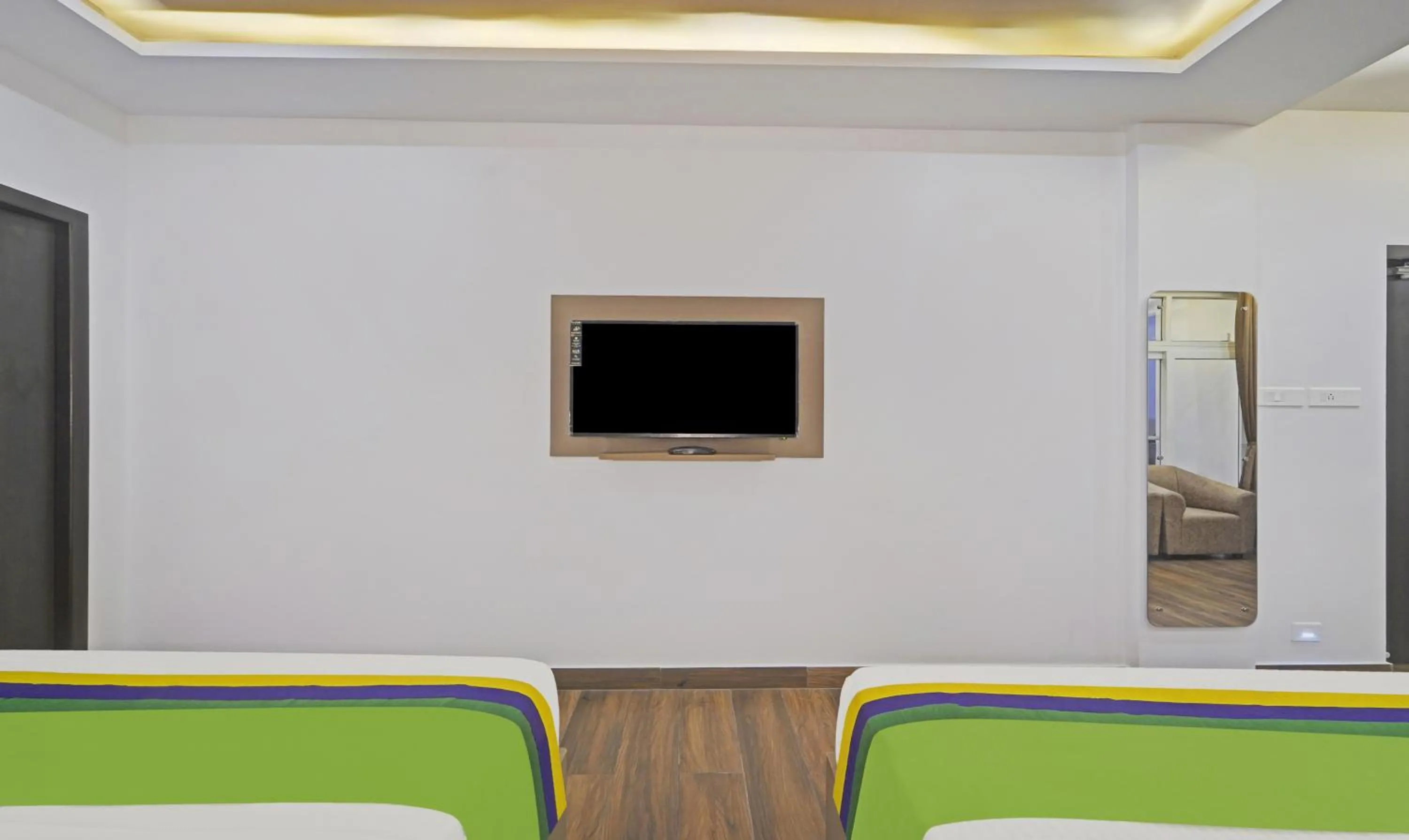 Bed in Treebo Premium Raffis' Andalusia Bay Way