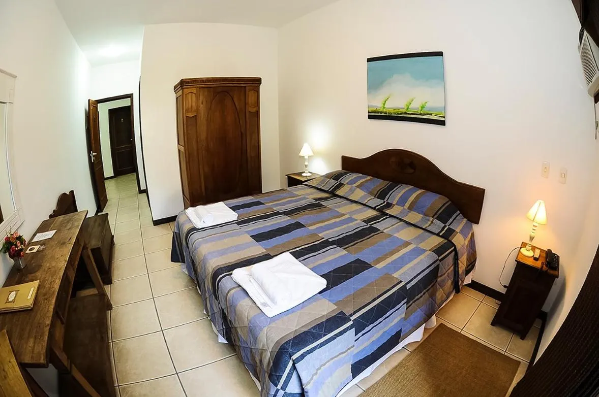 Bed in Pousada Arraial do Ouro