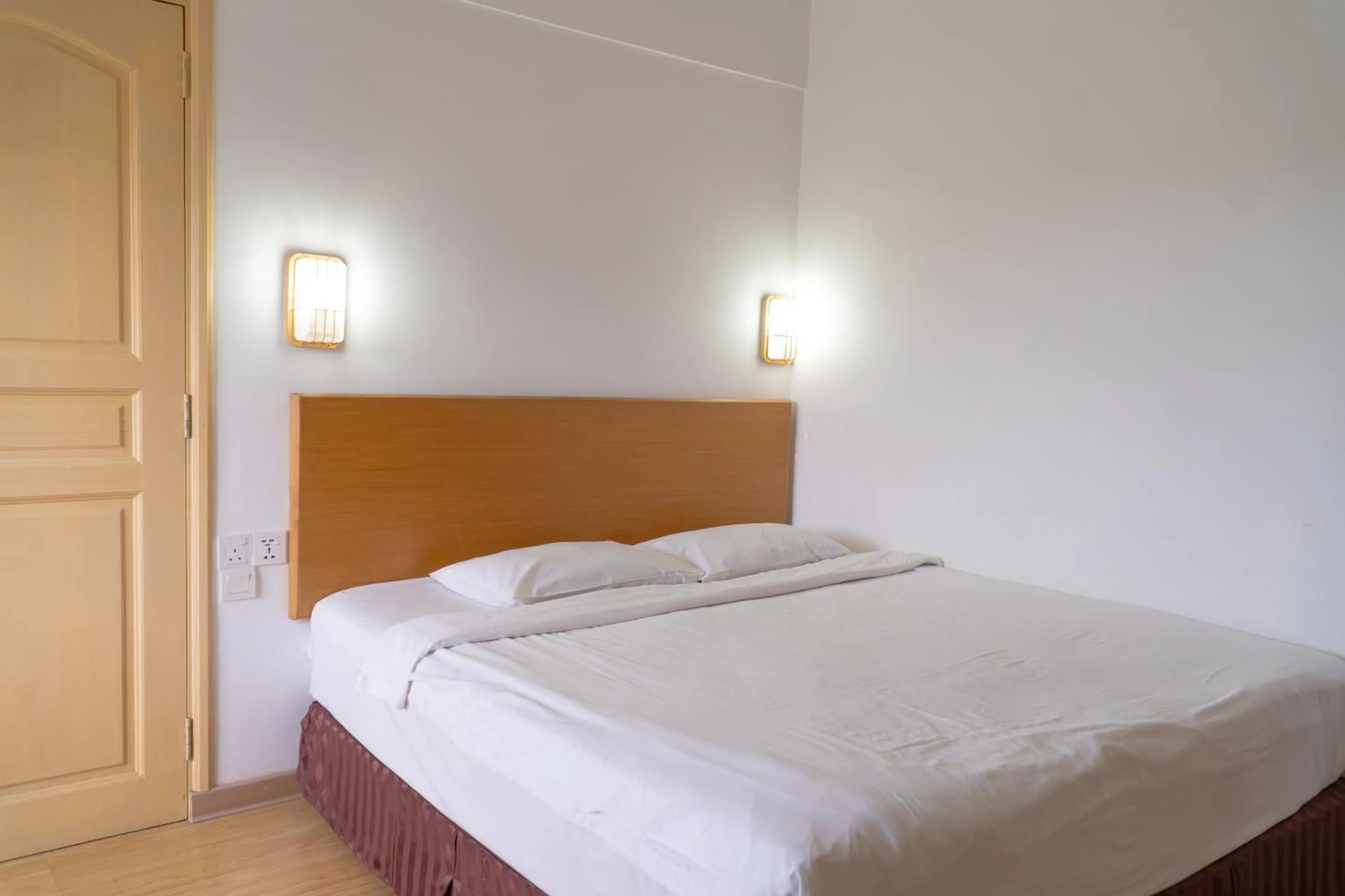 Bed in Borneo Suites Hotel