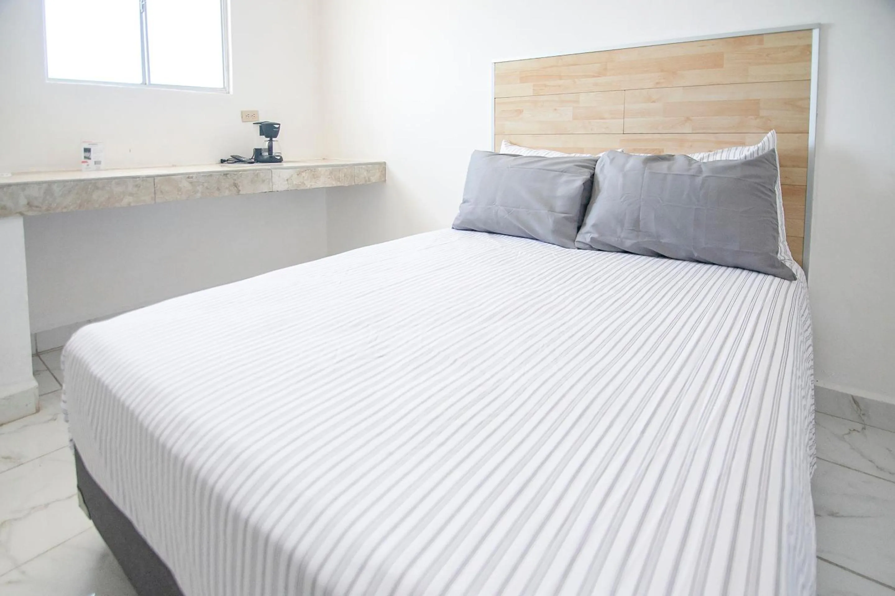 Bedroom, Bed in OYO Hotel Plaza Las Torres, Cabo San Lucas