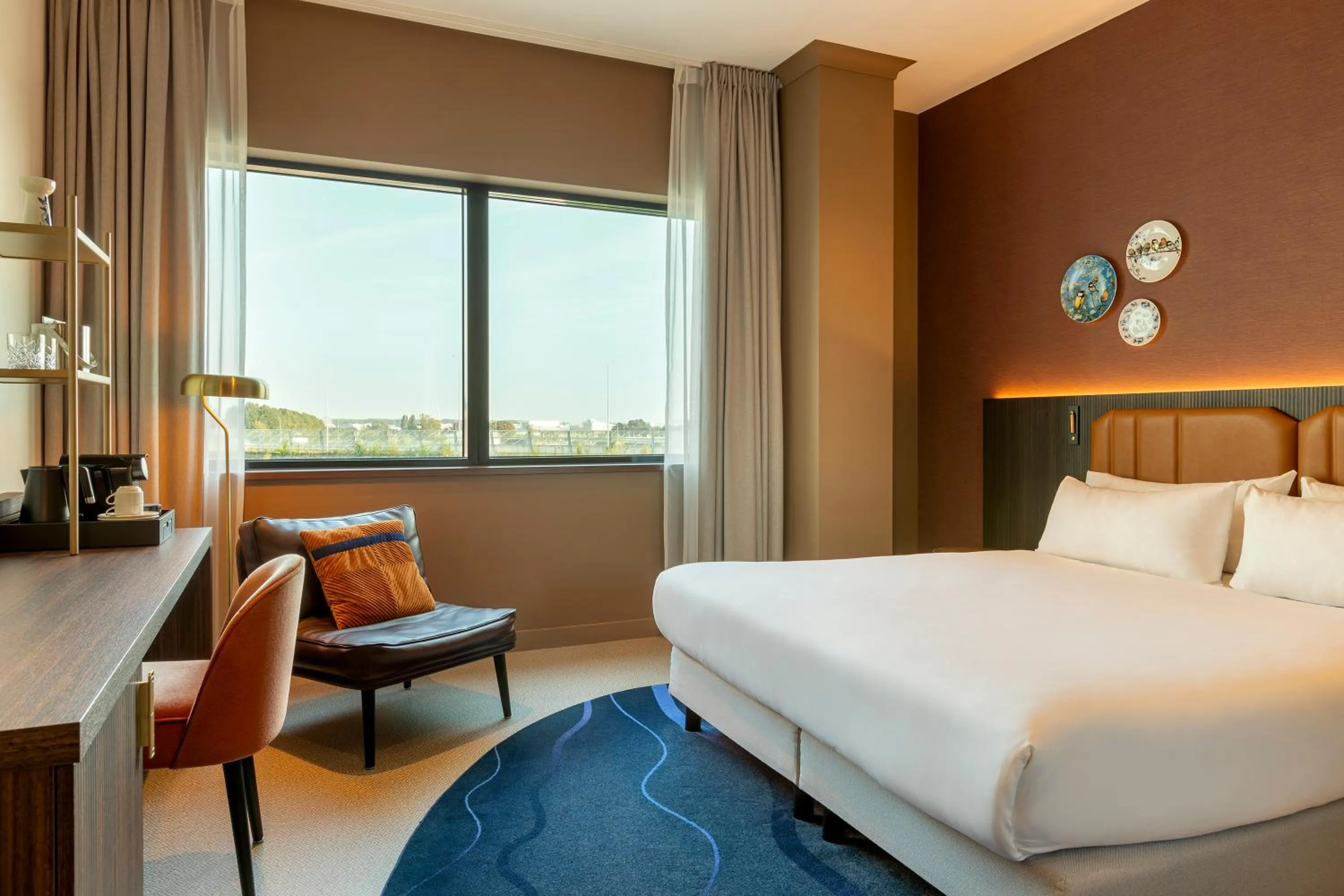 Seating area, Bed in Corendon Amsterdam Schiphol Airport, a Tribute Portfolio Hotel