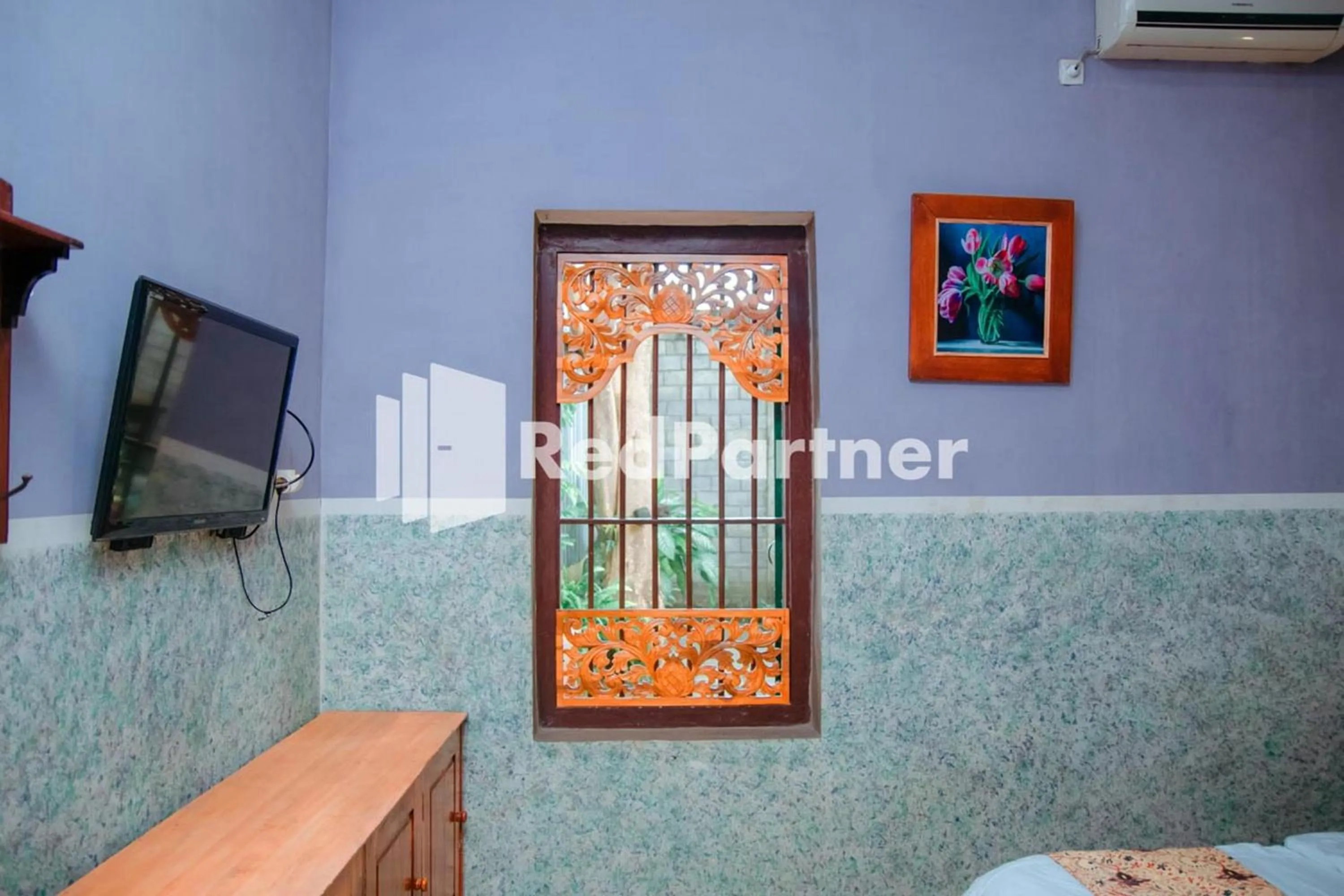 Bedroom in Flamboyan Asri Syariah Mitra RedDoorz near Kampung Inggris Pare