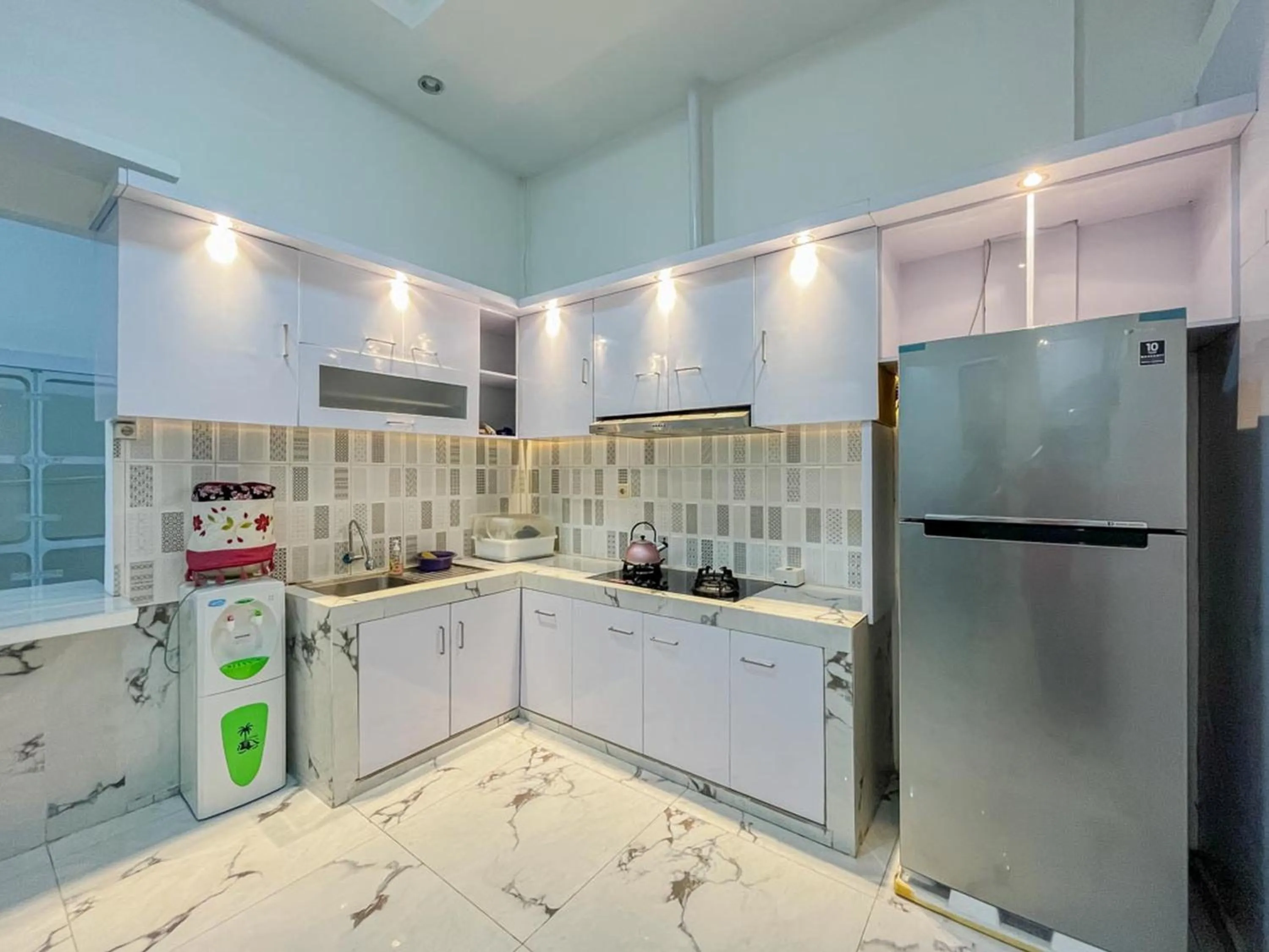 kitchen in Sakura Guest House by The Lavana