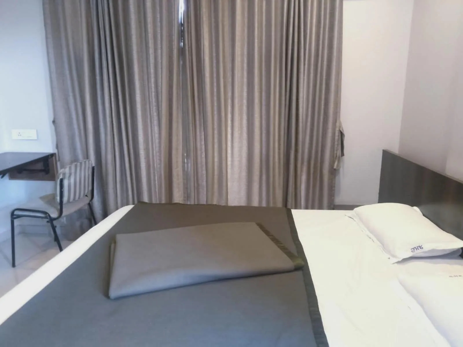 Photo of the whole room, Bed in Sai Heera Residency Shirdi