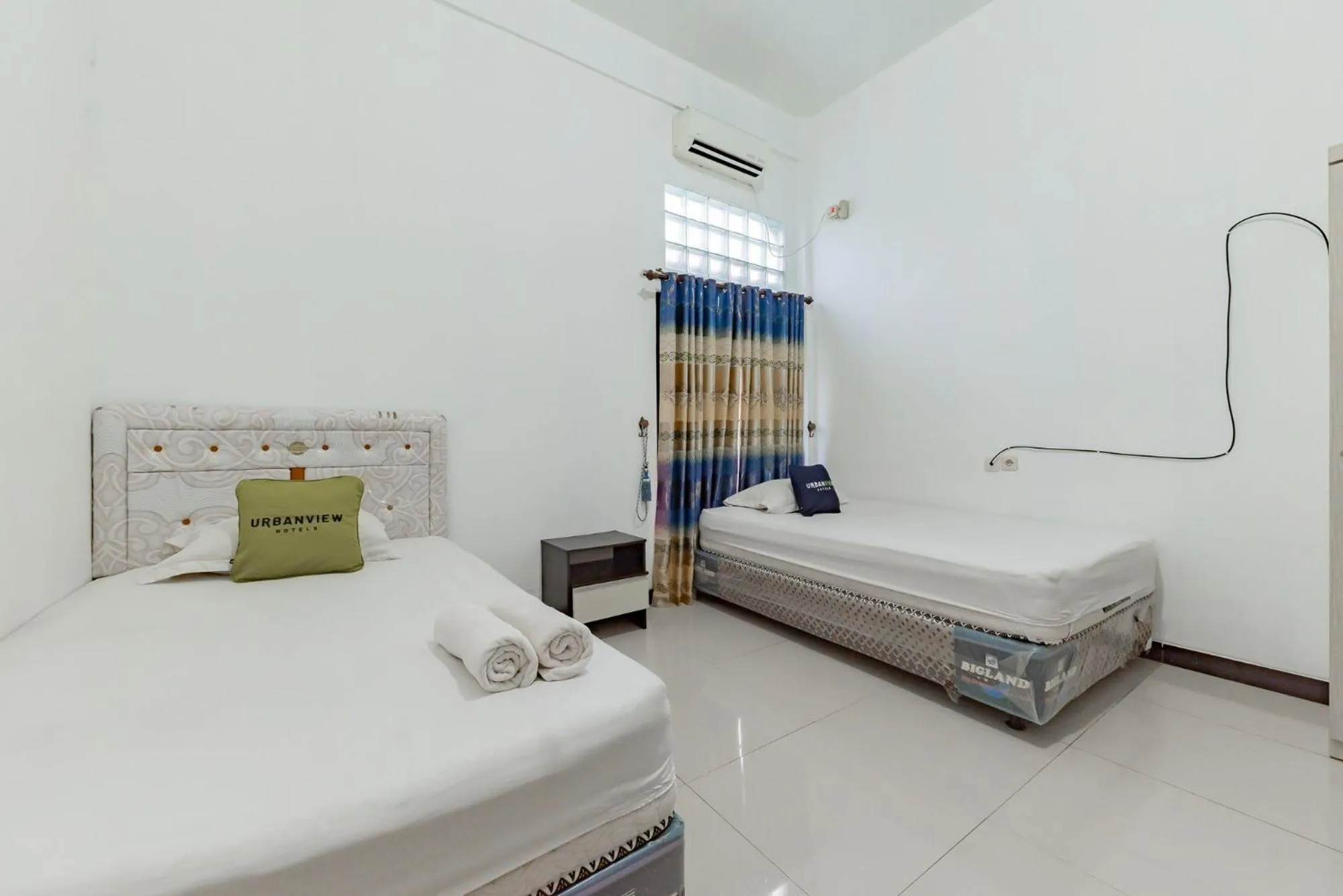 Bed in Urbanview Hotel Syariah 99 Banjarbaru by RedDoorz