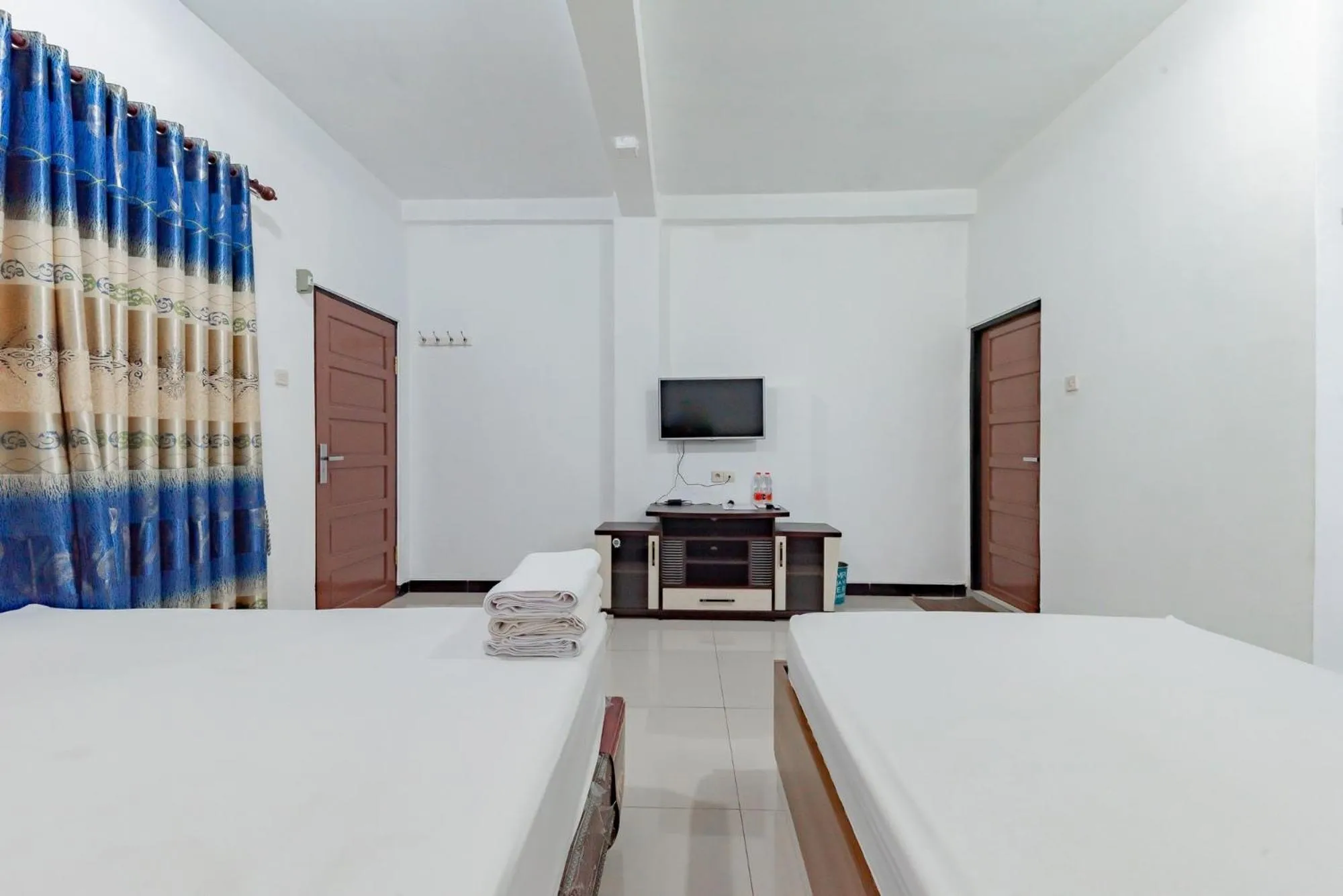 Bed in Urbanview Hotel Syariah 99 Banjarbaru by RedDoorz