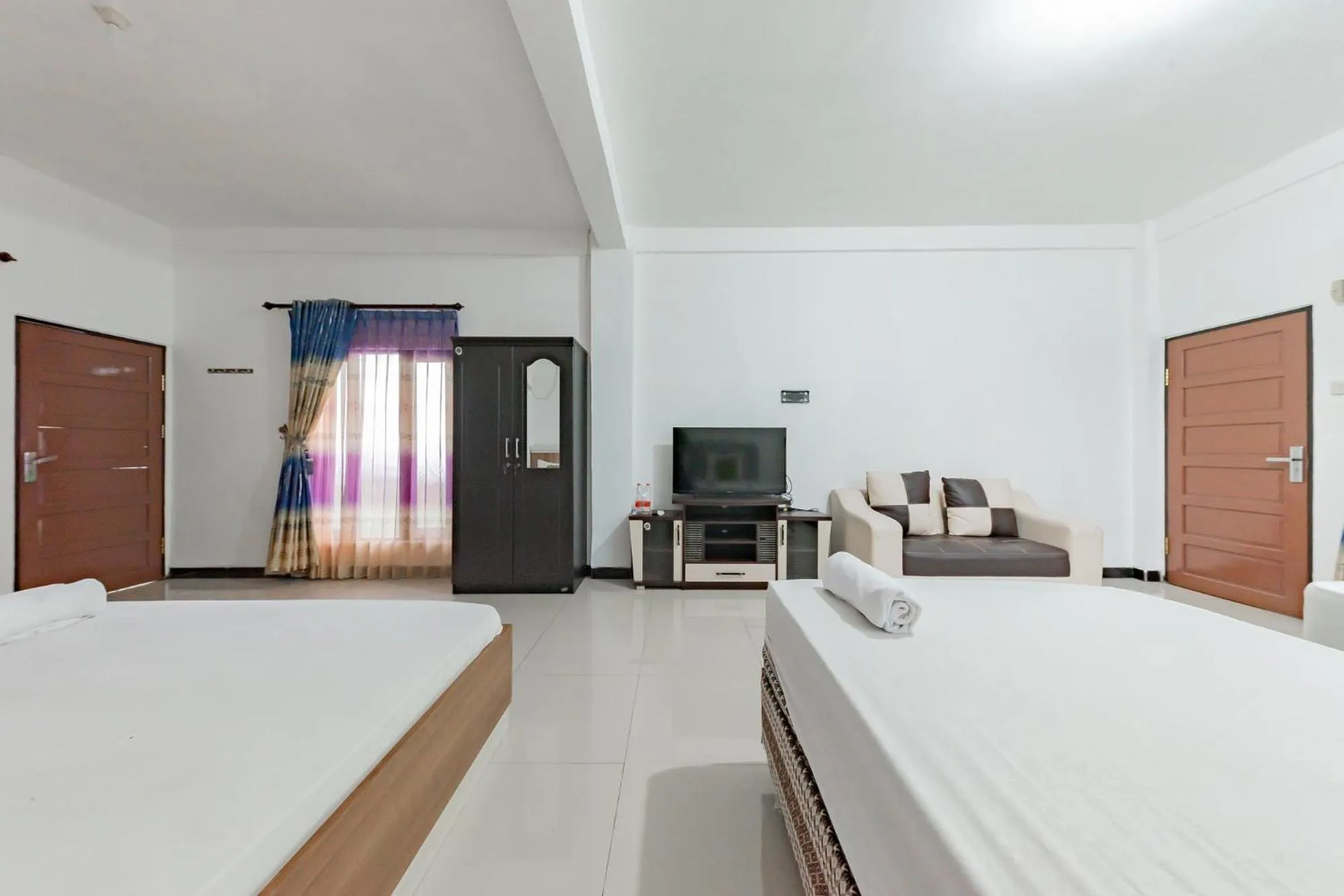 Bed in Urbanview Hotel Syariah 99 Banjarbaru by RedDoorz