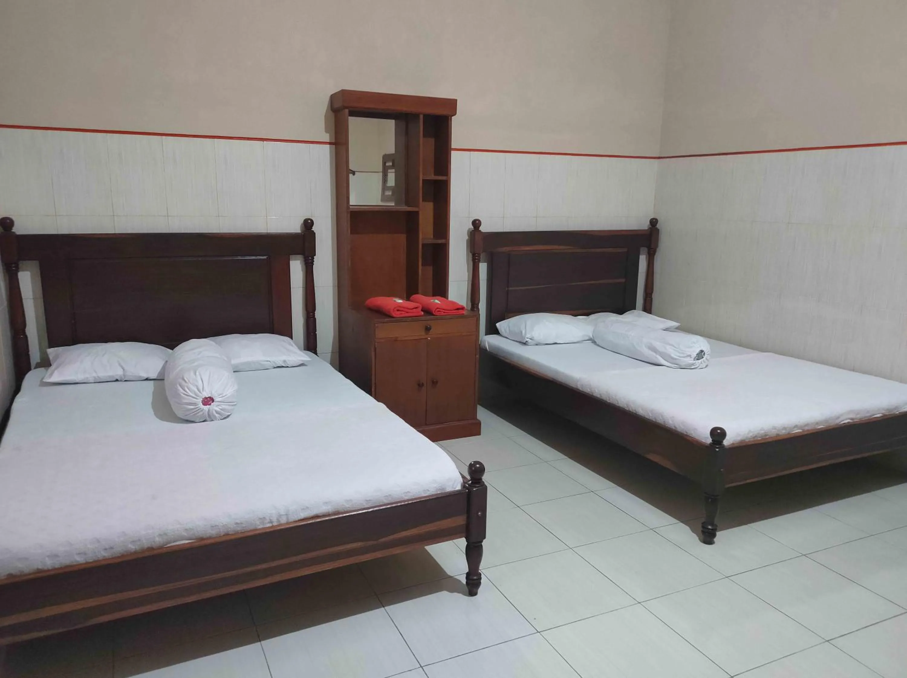 Bed in Penginapan Mentorogo Kaliurang Mitra RedDoorz