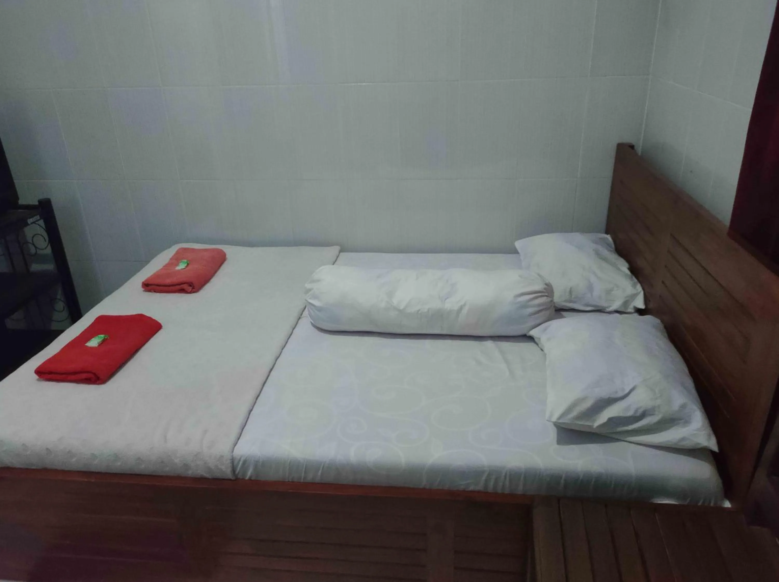 Bed in Penginapan Mentorogo Kaliurang Mitra RedDoorz