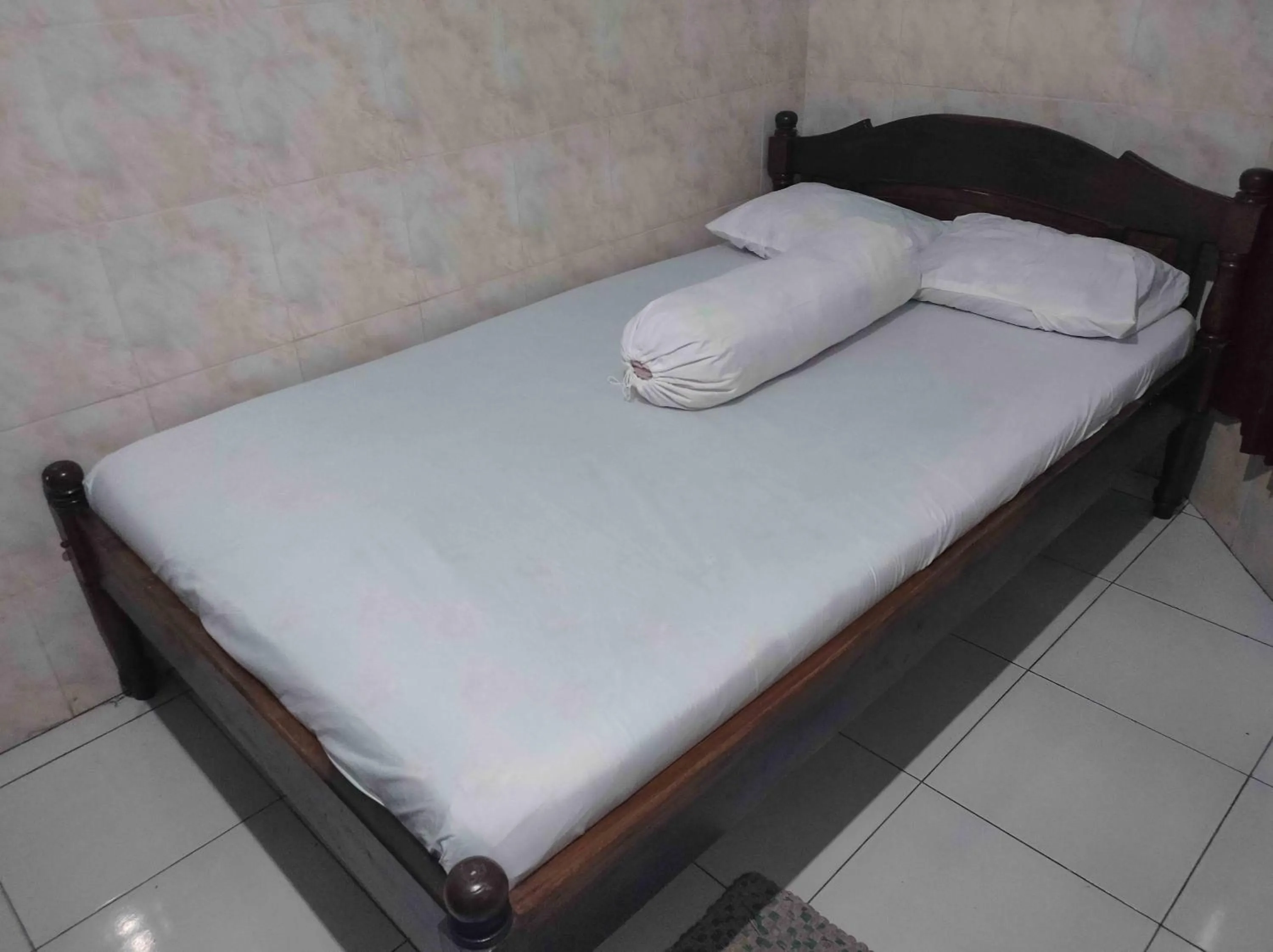 Bed in Penginapan Mentorogo Kaliurang Mitra RedDoorz