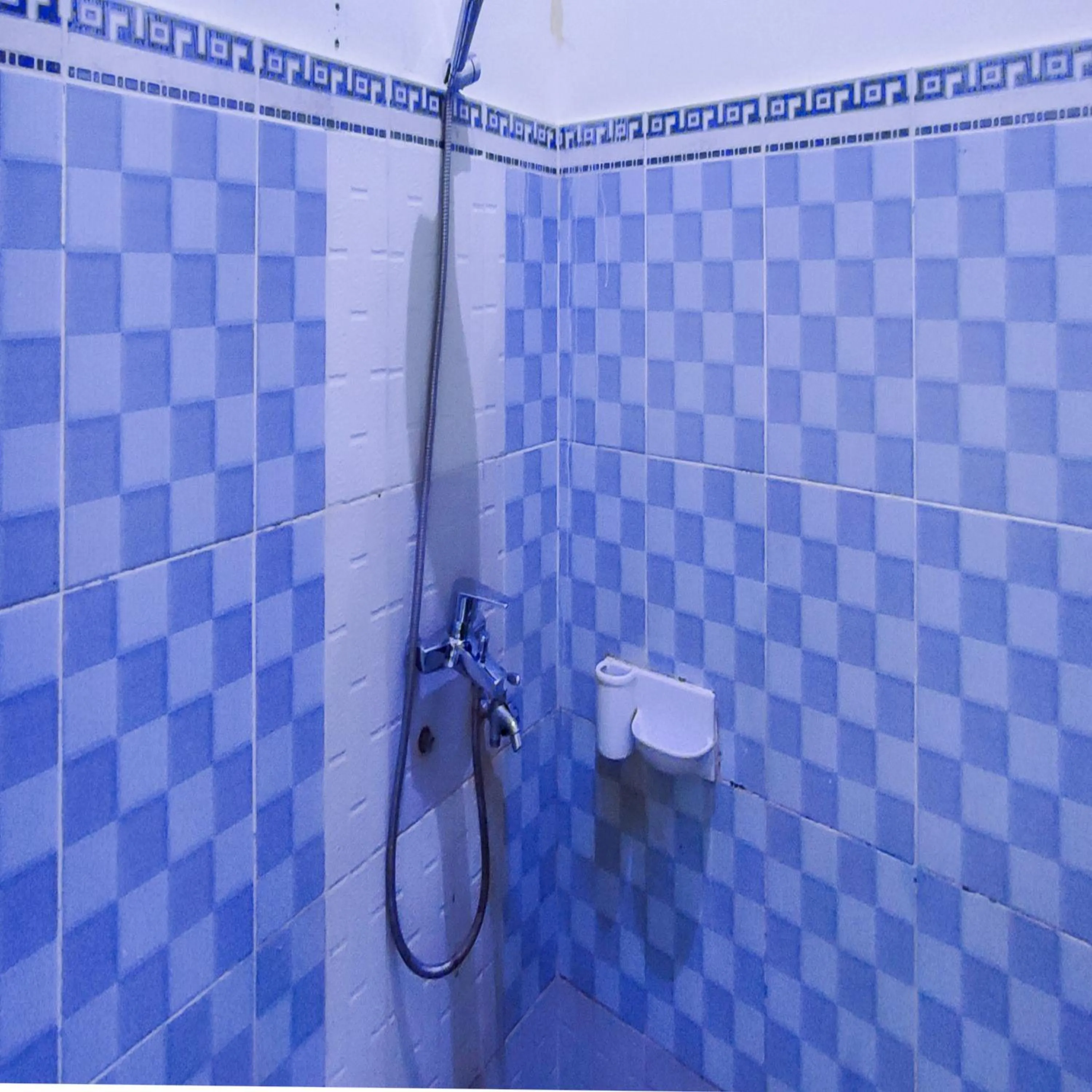 Bathroom in RedDoorz Syariah at Khalifi Guest House Padang