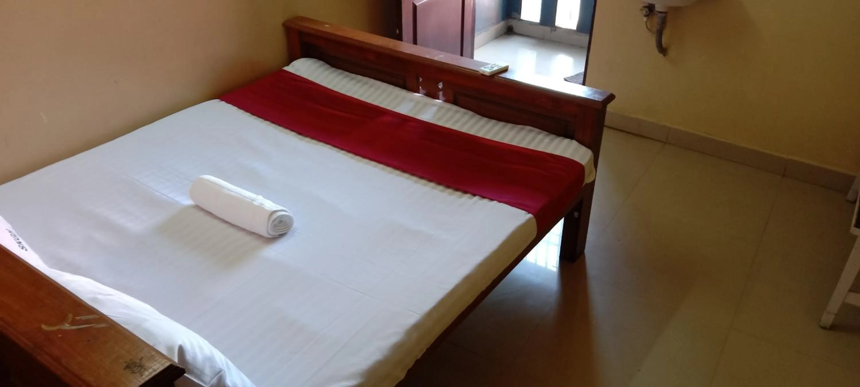 Bed in Sri Krishna Guest House