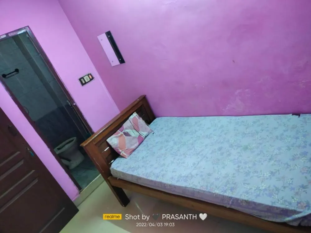 Bed in Sri Krishna Guest House