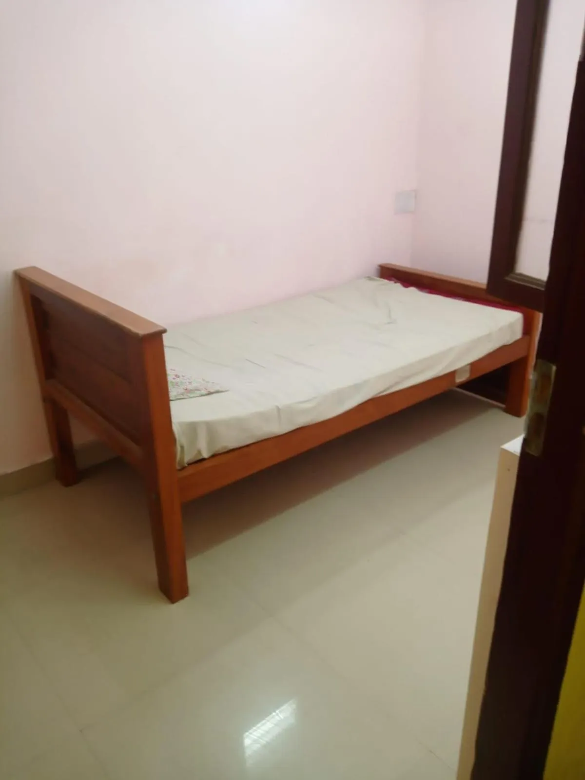 Bed in Sri Krishna Guest House