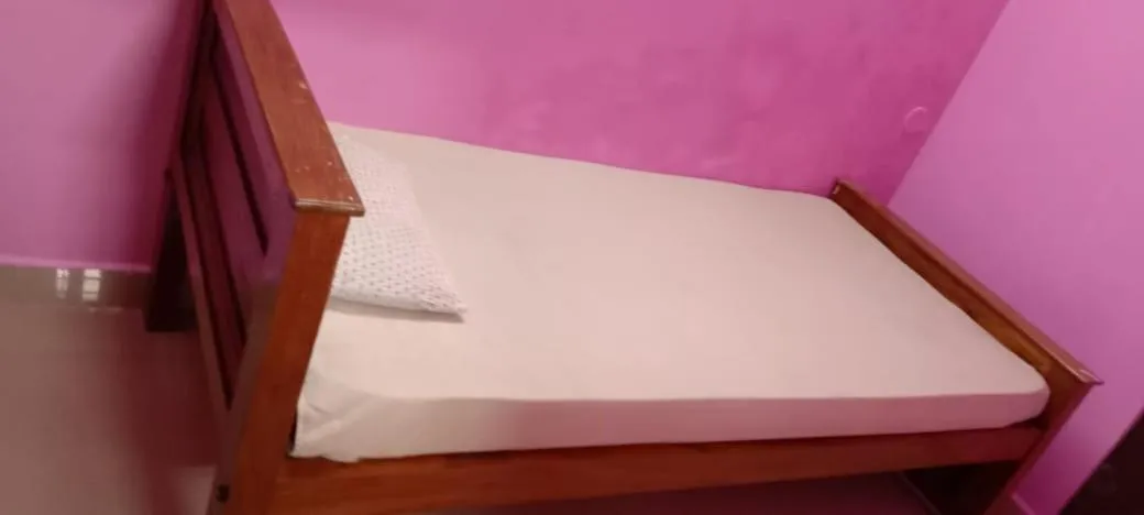 Bed in Sri Krishna Guest House