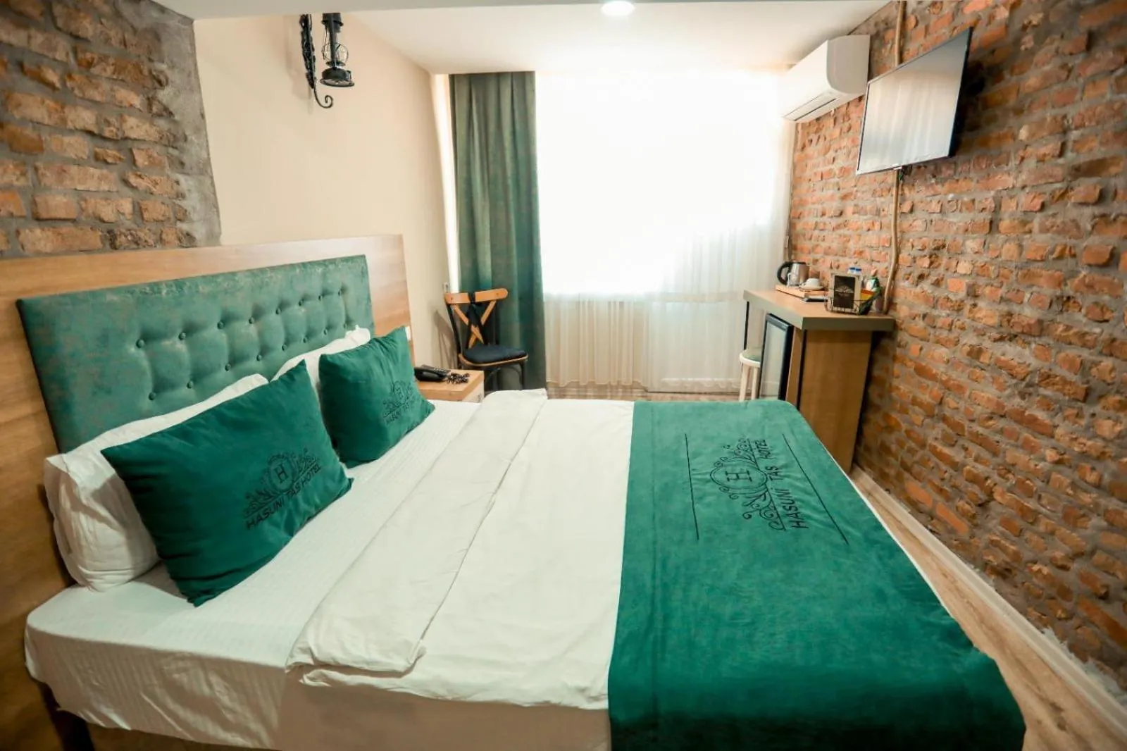 Bed in HASUNİ TAŞ HOTEL