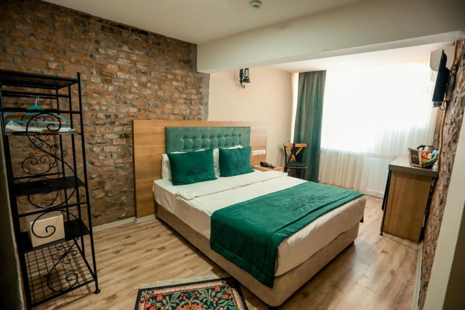 Bed in HASUNİ TAŞ HOTEL