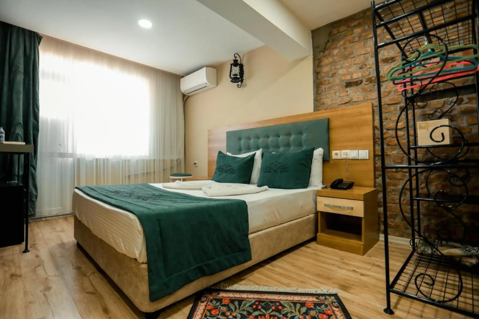 Bed in HASUNİ TAŞ HOTEL