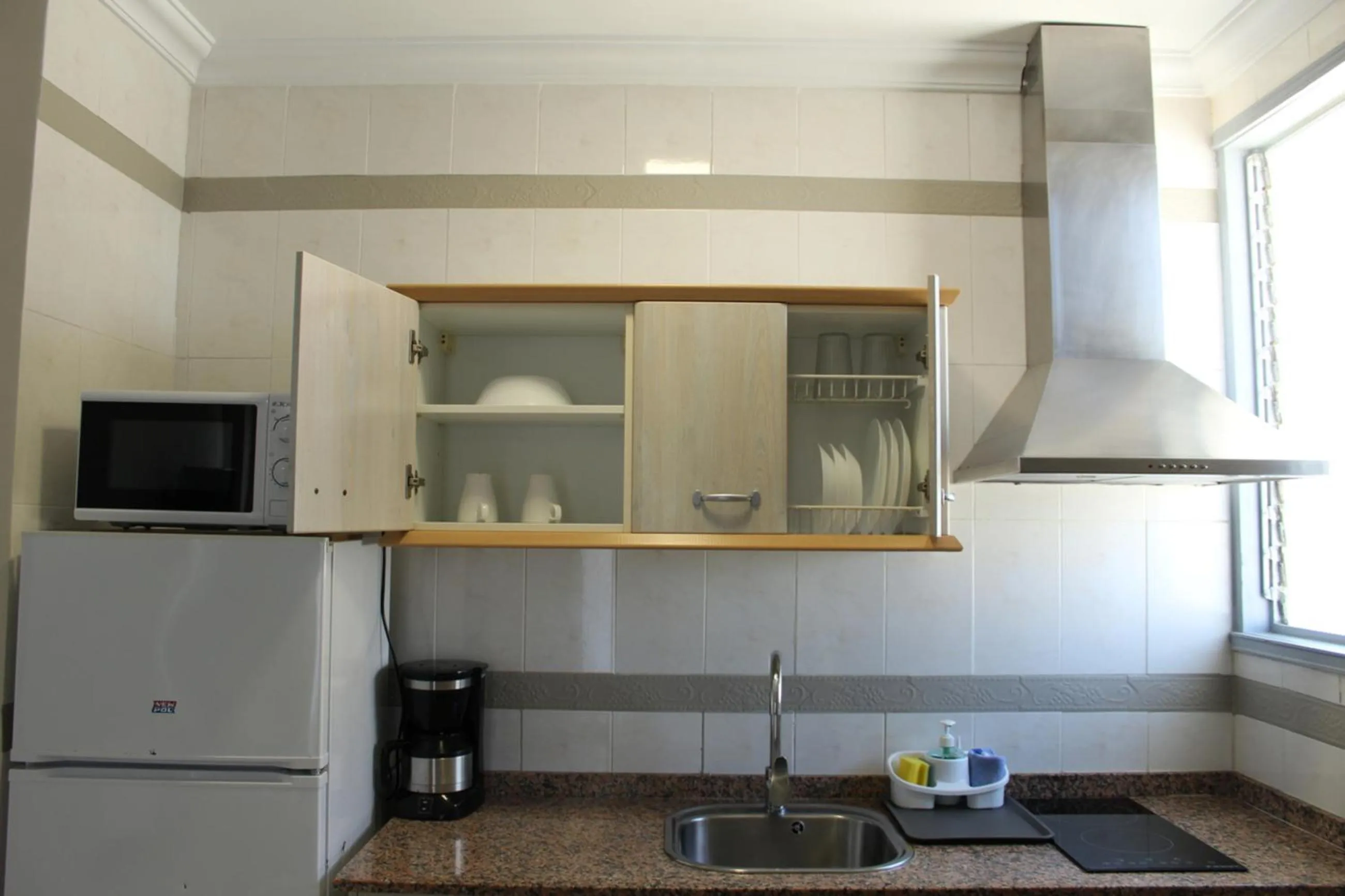 Kitchen or kitchenette in Apartamentos Fayna